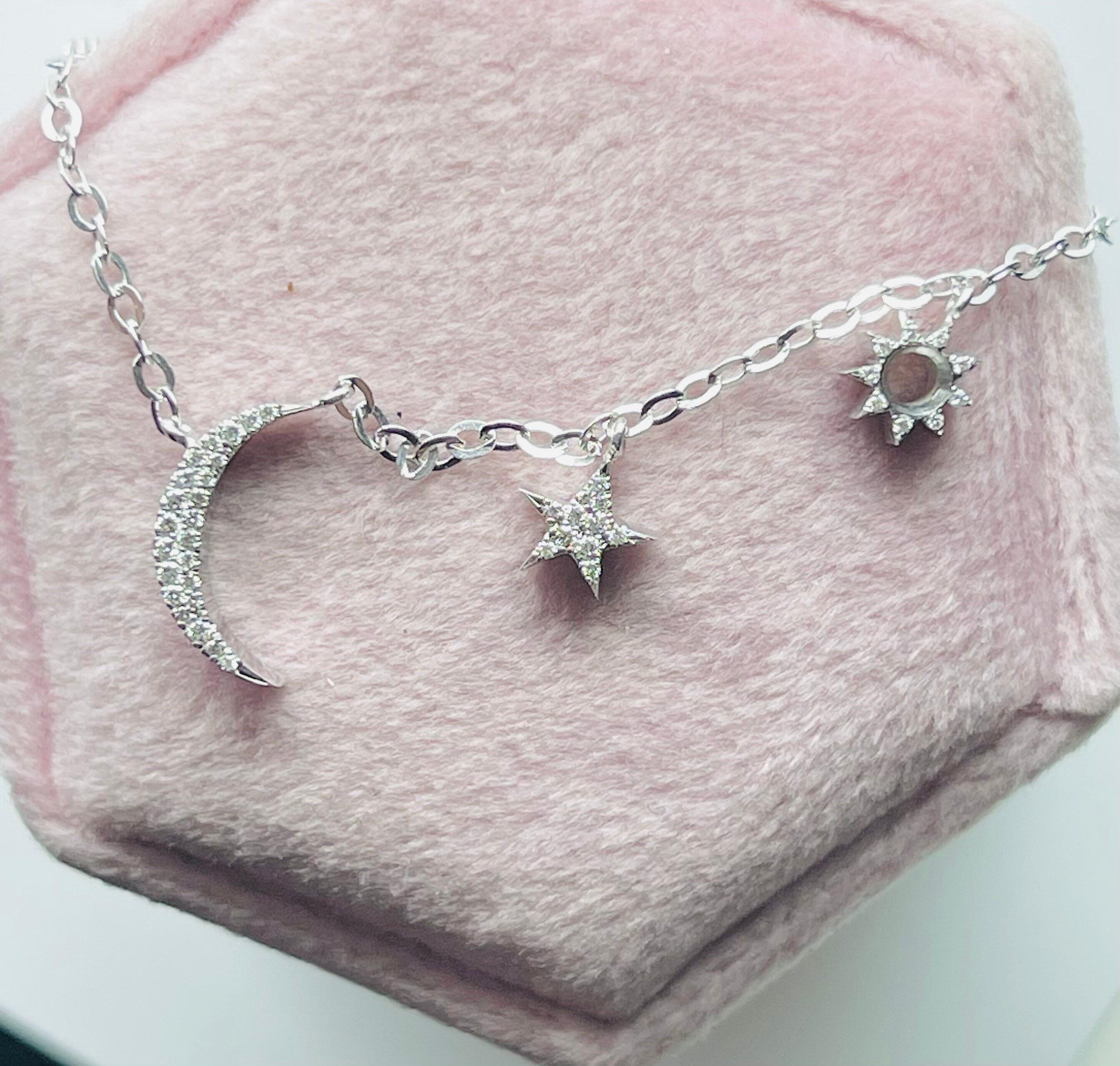 Pretty minimalistic luxurious diamond pendant necklace with a single moon, star and sun.
The necklace is 16-18