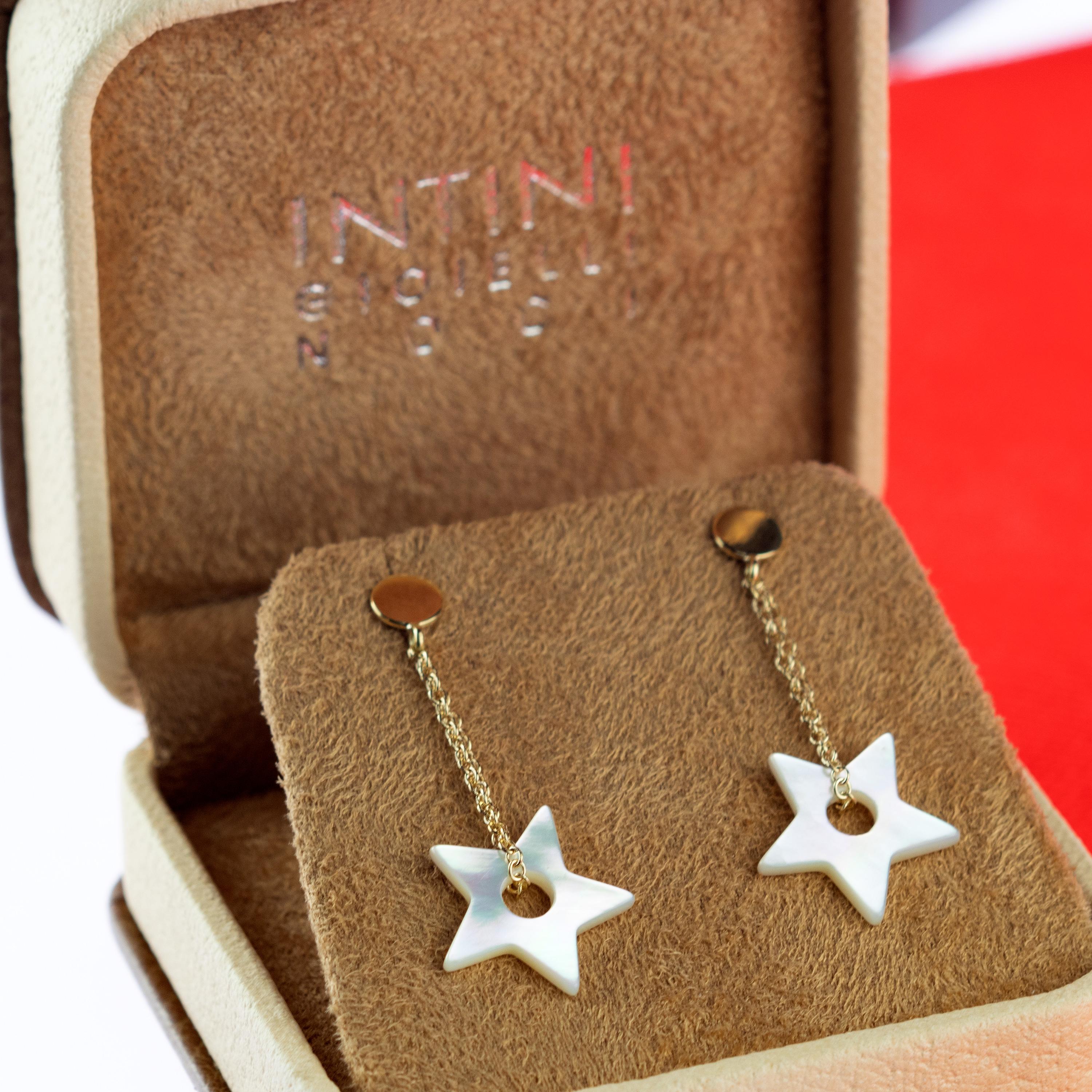 Dangle natural mother of pearl star shaped earrings with a circle hole inside, holded by 18 Karat Yellow Gold. Contemporary and unique piece designed with a modern and youthful style.

Stars have been symbolic of divine guidance and protection.