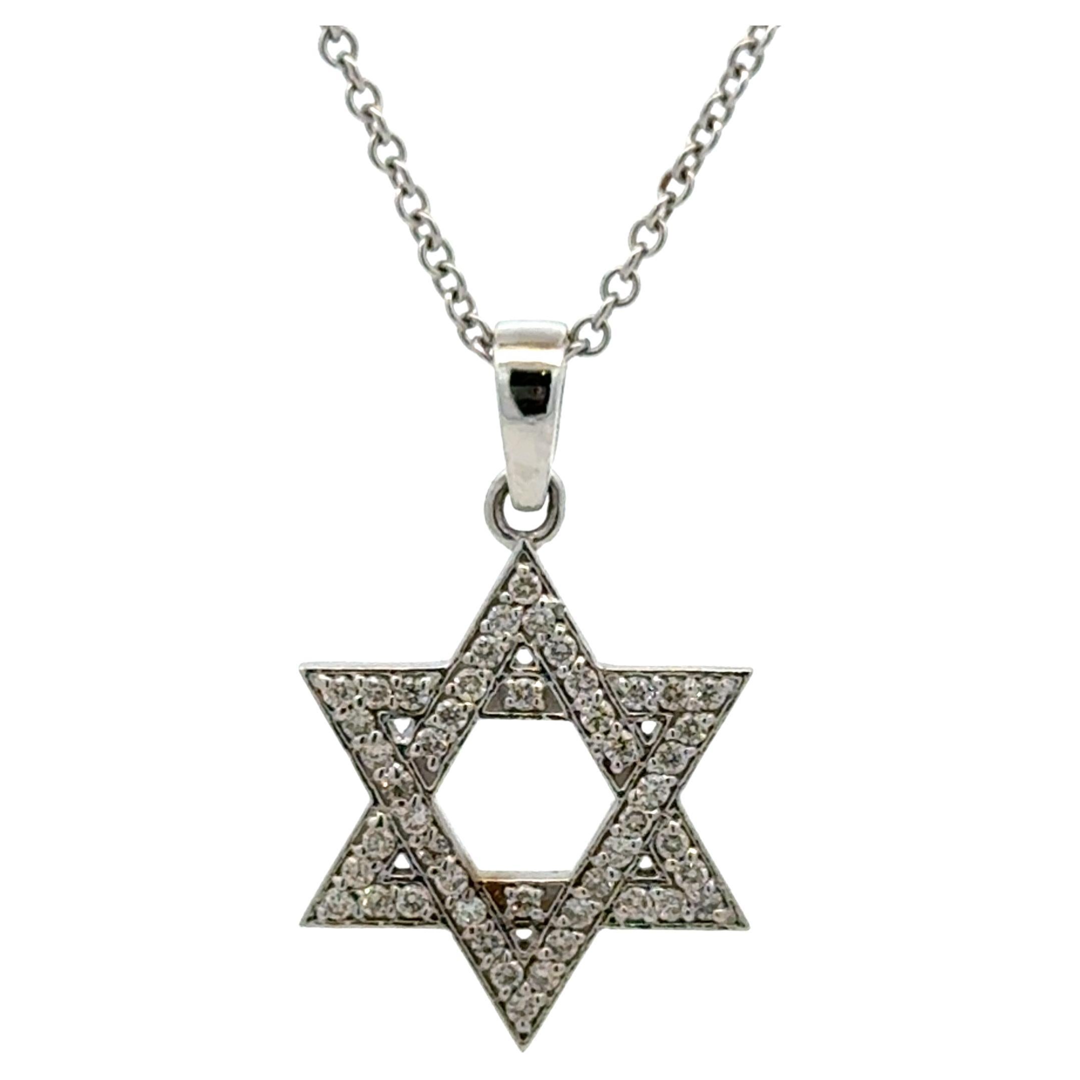 14 Karat white/yellow gold pendant featuring a Star of David with 49 round brilliants weighing 0.41 carats.
Available in Yellow or White Gold.

Pendant 19.8 mm
Bale 6.5 mm

More Star of David in Stock.
Message for pictures and details.