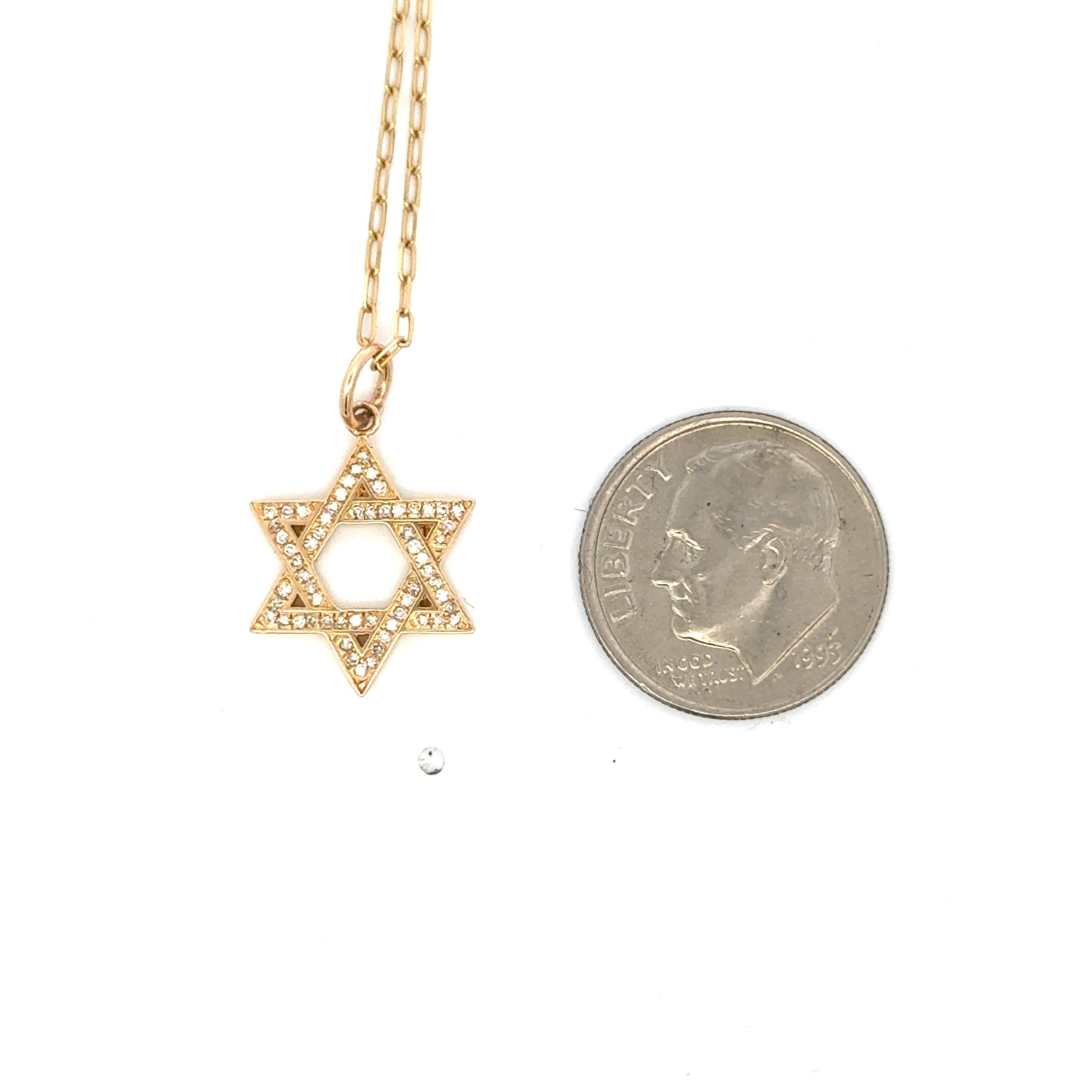 Star of David pendant featuring round brilliants weighing 0.11 carats in 14 karat yellow gold. 