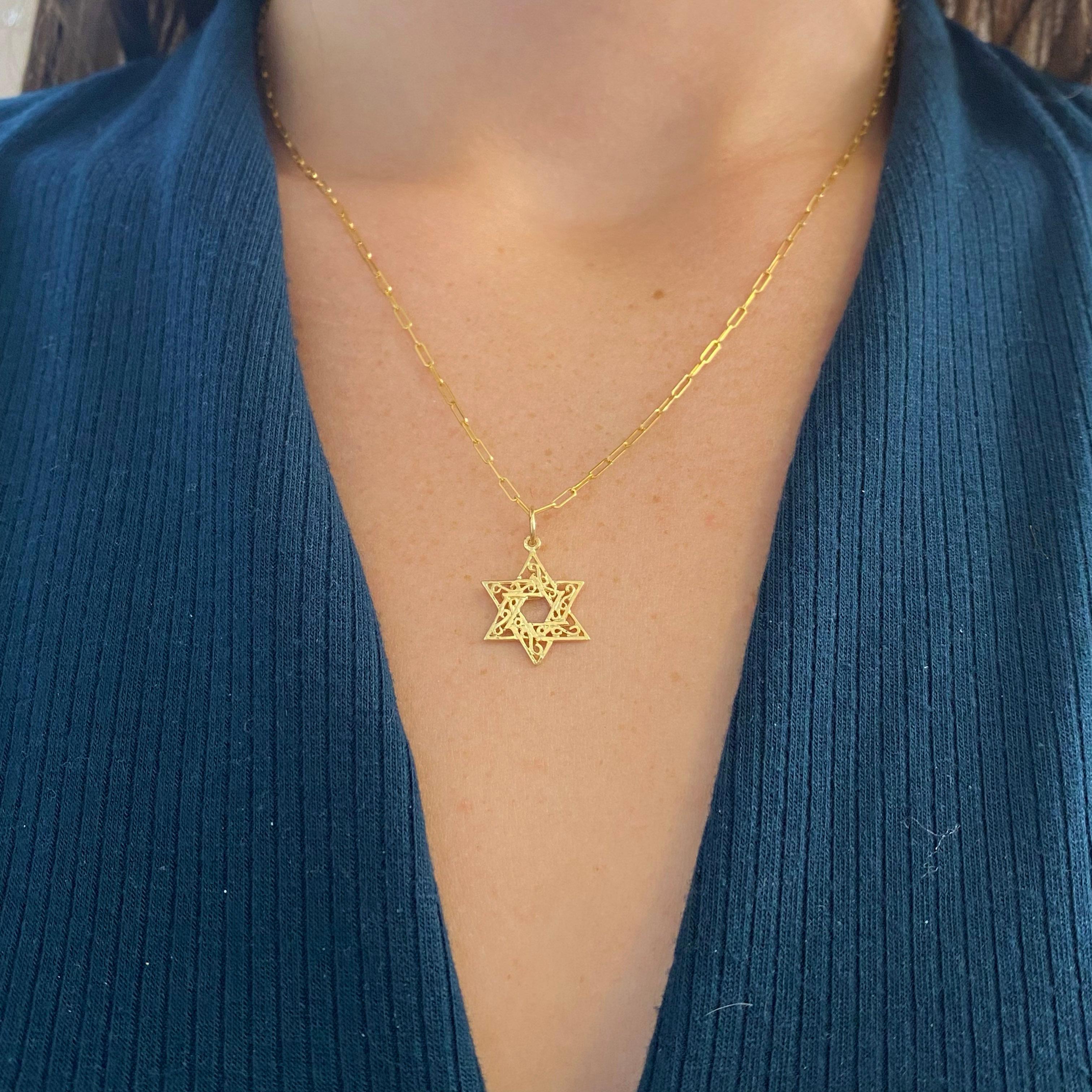 This cute Jewish Star of David looks good on most gold chains! It could also go on a charm bracelet. The open gold work is very attractive and it would make a great gift!
Metal Quality: 14 karat yellow gold
Pendant Style: Star 
Measurements of