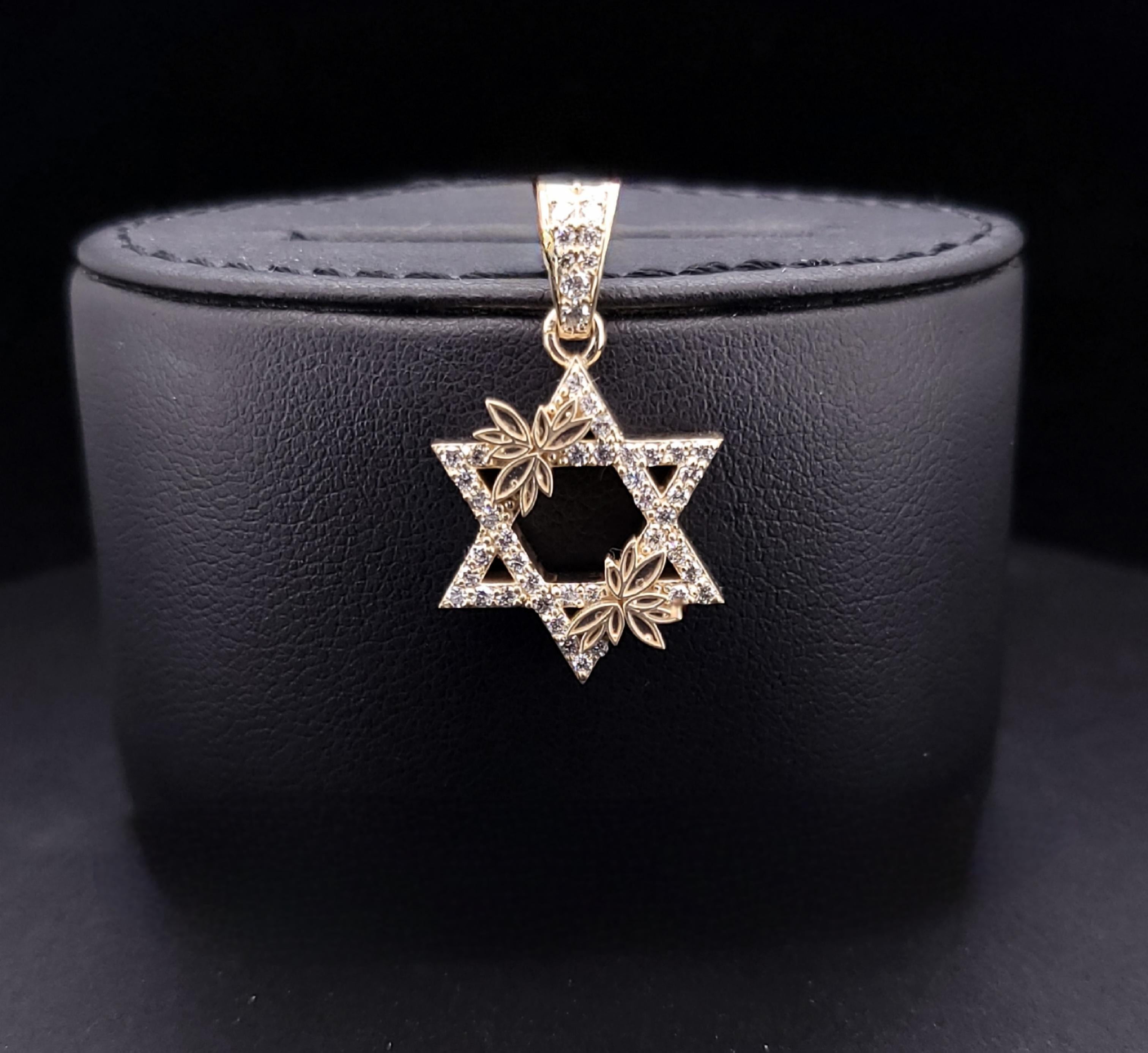 Star of David pendant 14K Yellow Gold .75ct diamonds
for more info contact us

Material: 14K Yellow Gold
Diamonds: VS G .75 ct
Ring Weight: 6.1 gm
Size: 19.5mm(29 mm with bell) x 19.5 mm
Thickness: 4 mm