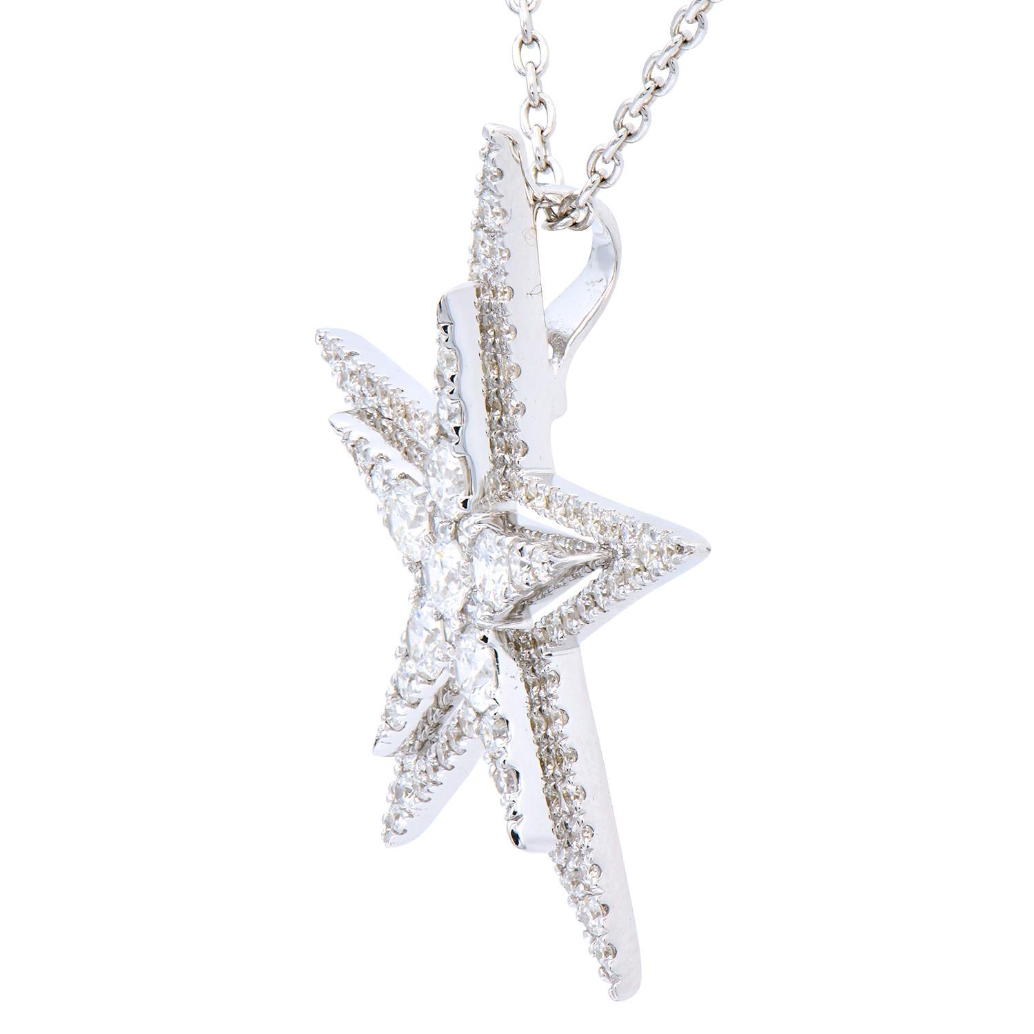 This star pendant shines bright with 96 round VS2, G color diamonds that total 0.87 carats. They are set in 2.5 grams of 18 karat white gold. This stunning 5 points star comes with an 18 karat white gold chain that can be worn at 3 different lengths