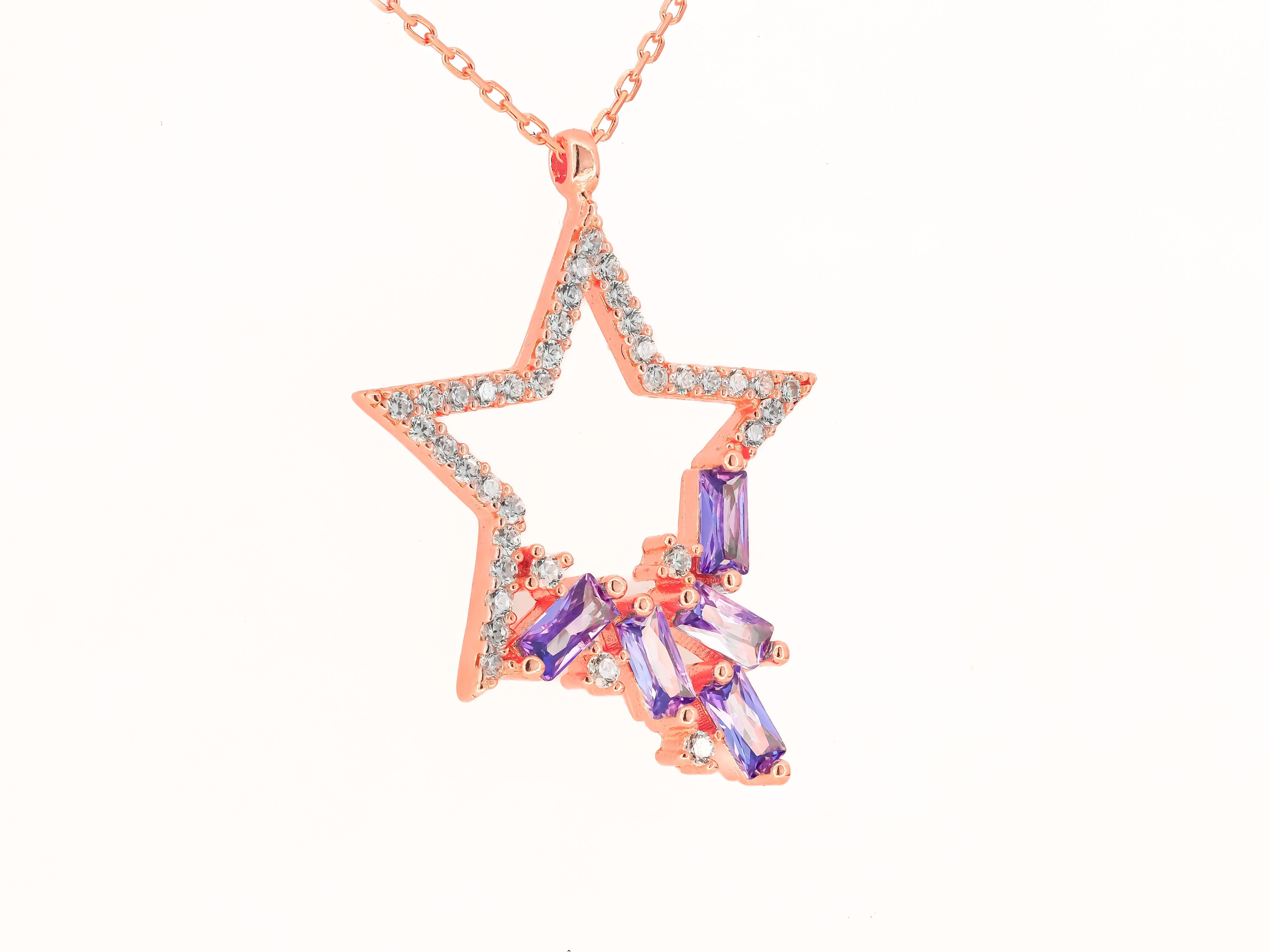 Modern Star pendant necklace with diamonds and amethysts in 14k gold. 
