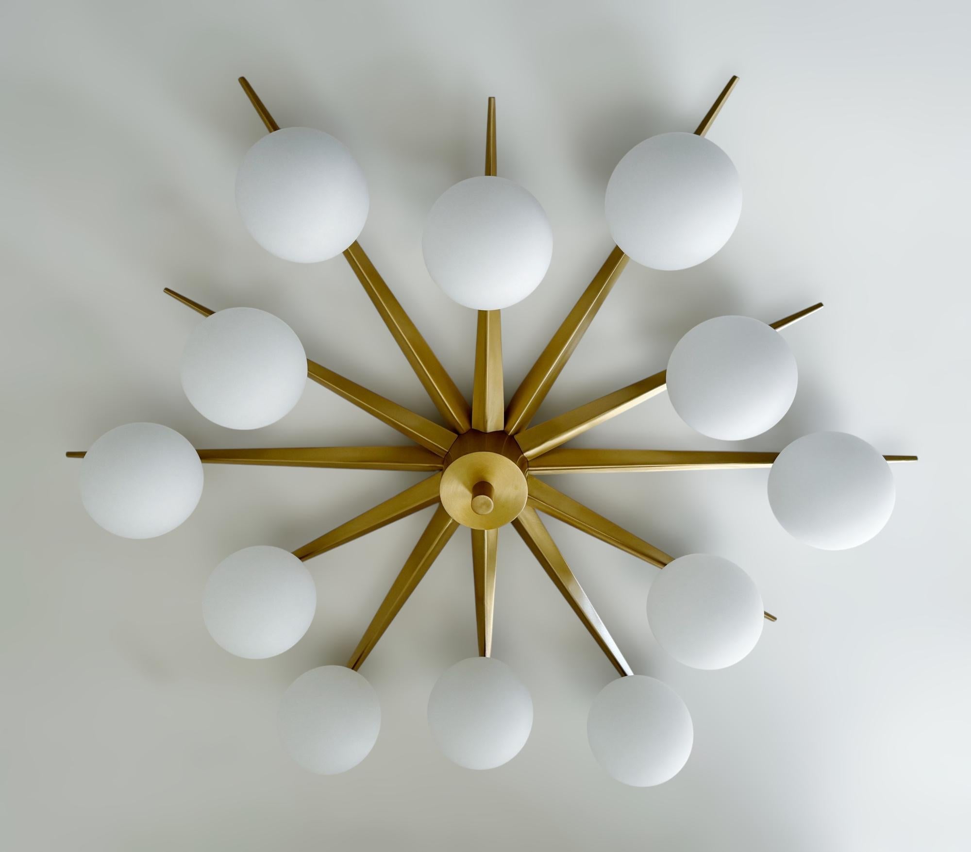 Italian flush mount with 12 matte white Murano glass globes mounted on solid brass frame in satin brass finish / Made in Italy
Designed by Fabio Ltd, inspired by Angelo Lelli and Arredoluce styles
12 lights / E12 or E14 type / max 40W each
Diameter: