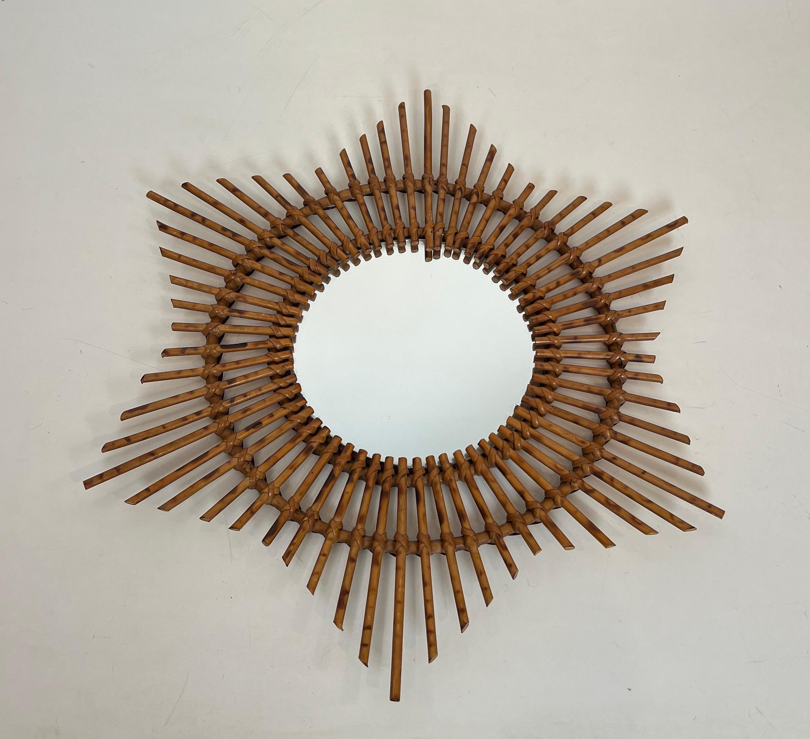 This nice Star mirror is made of rattan. This is a French. Circa 1970