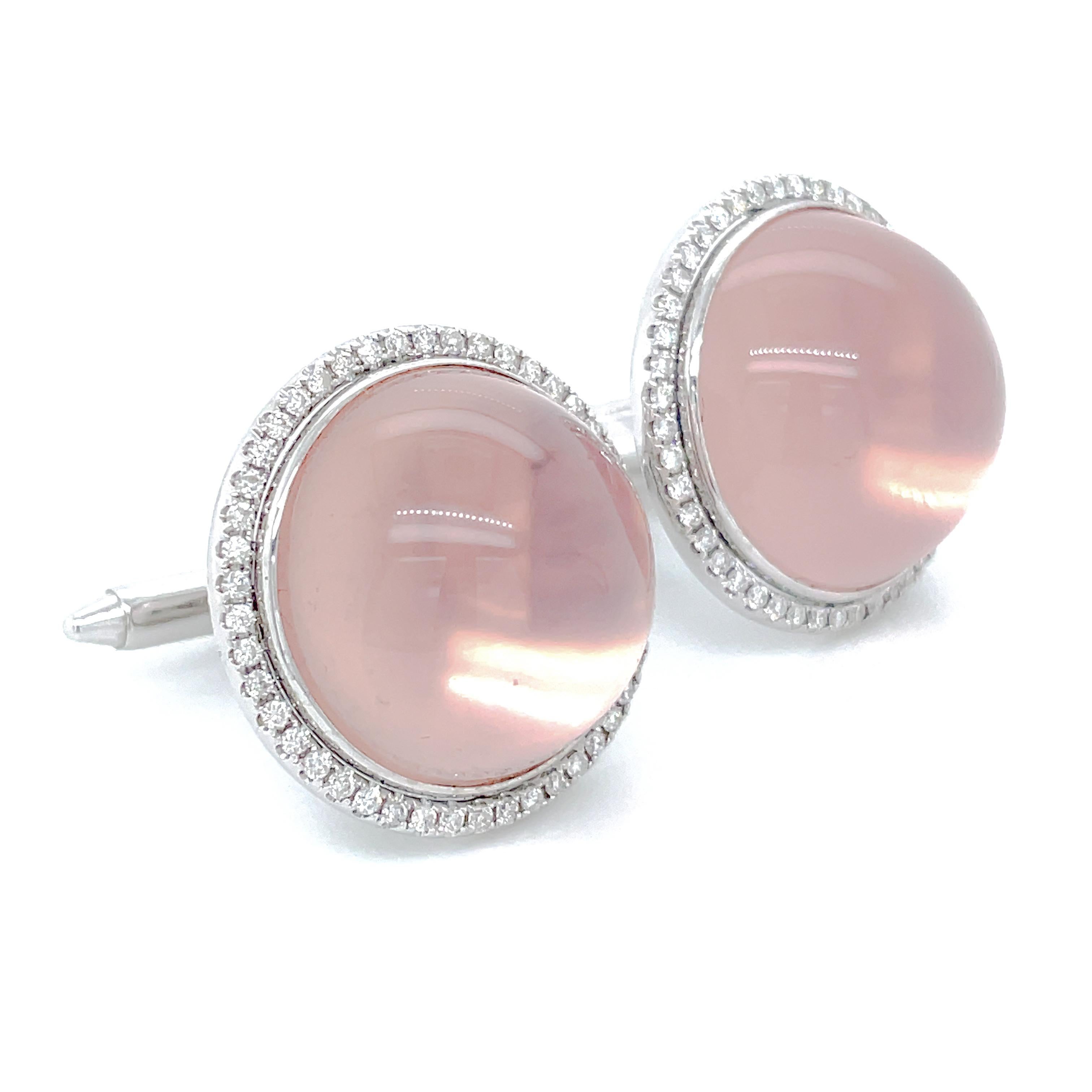 Exquisitely crafted cufflinks feature two stunning star rose quartz cabochons totaling 75.14 carats, each adorned with a mesmerizing asterism effect.

Hold the cufflinks under a bright light source to see the beautiful asterism. 

Watch as the