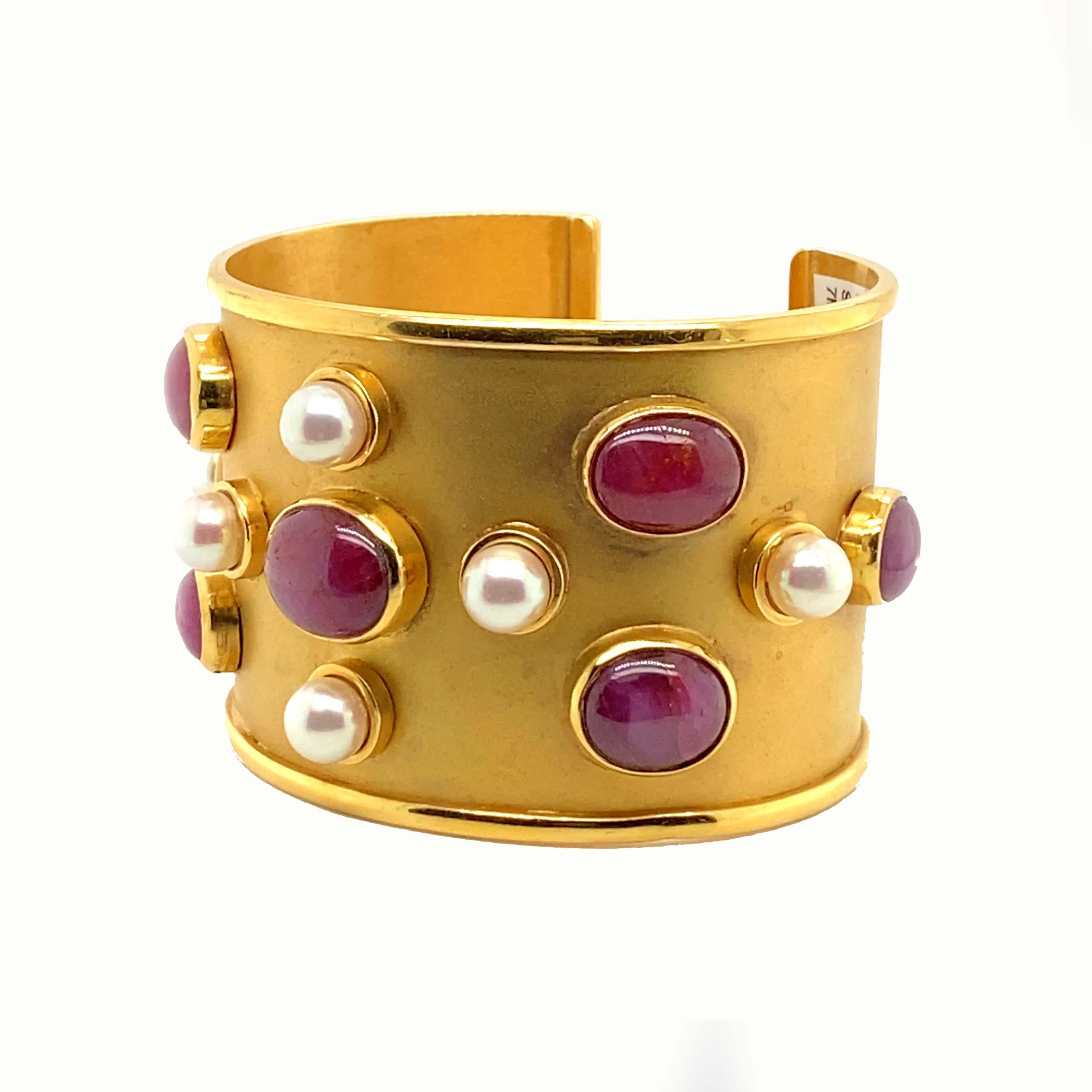 Star rubies are absolutely magical and one of the rarest types of rubies. When reflecting light you'll be able to see beautiful light, star patterns on the rubies. Each earring includes a star ruby, The yellow Gold Cuff bracelet is dotted with large
