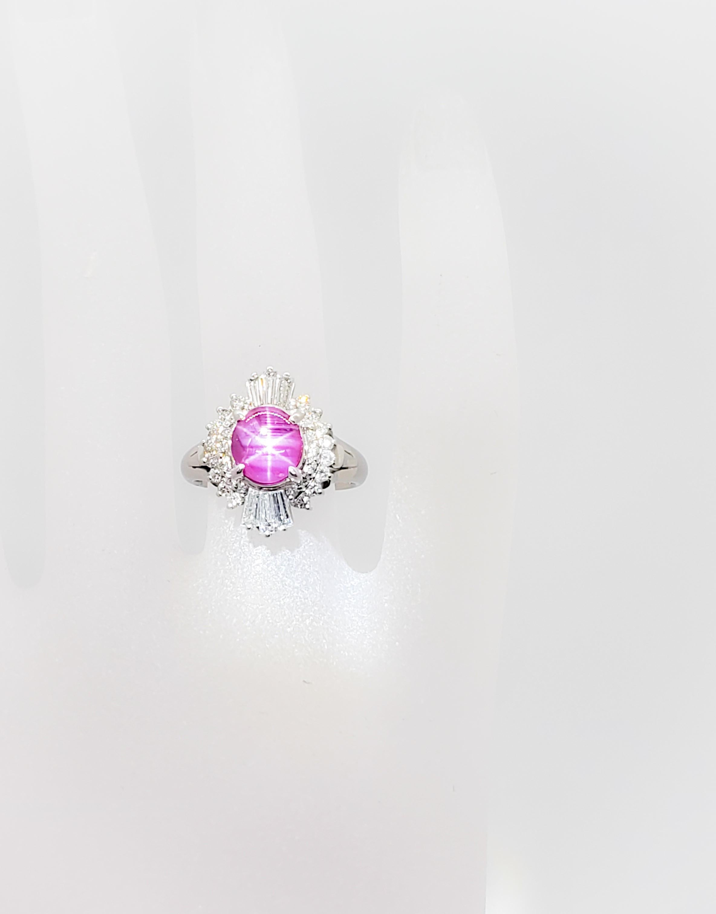 Stunning 3.33 ct. star ruby oval cabochon and 0.82 ct. of good quality white diamond rounds and baguettes in this cocktail ring.  The star is bright and prominent.  Handmade in platinum, ring size 6.5.  Estate piece in mint condition.