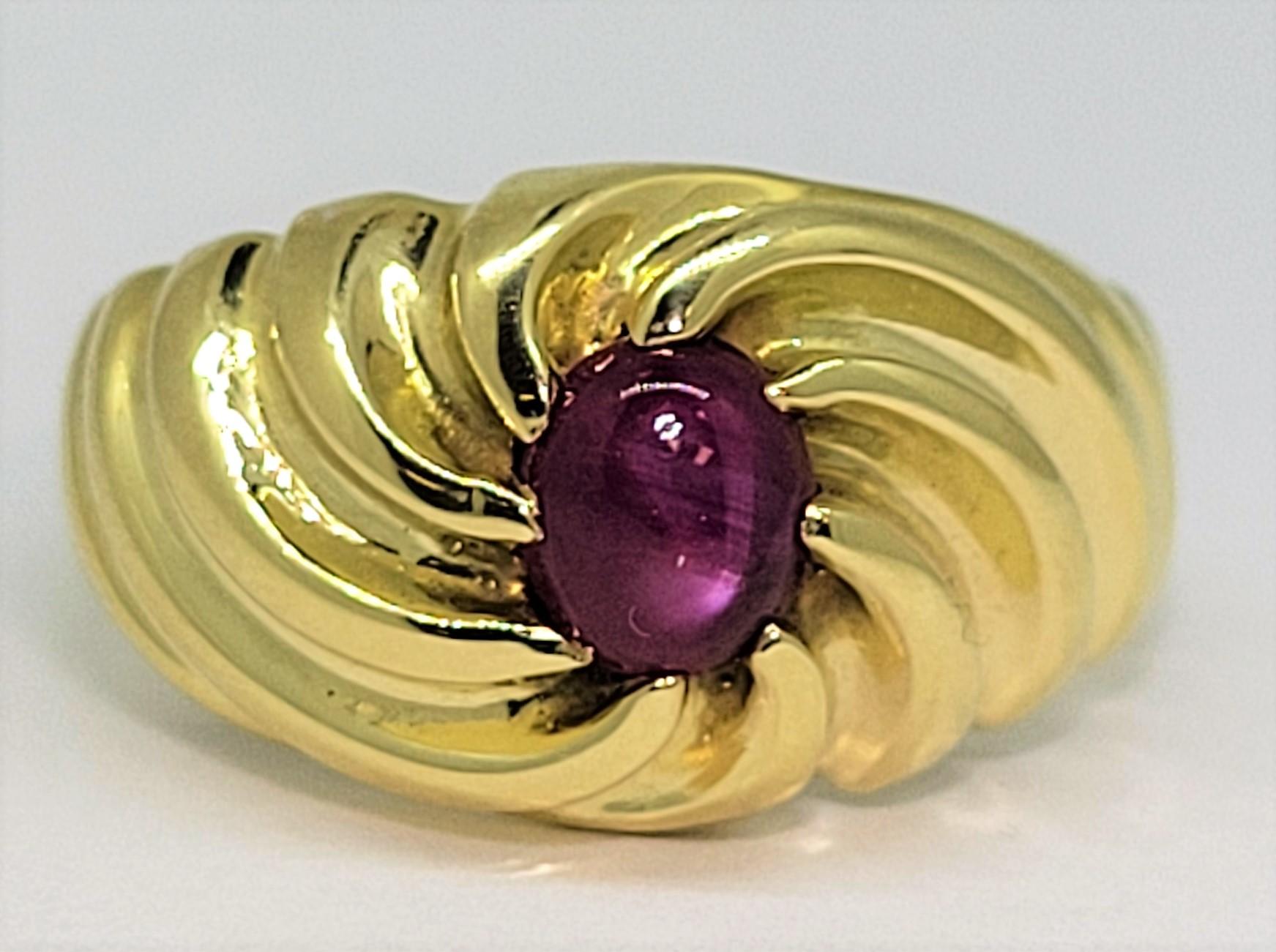 Hard to find 1.63 carat cabochon Star Ruby set in 18 karat yellow gold.  This ring is a size 10.5