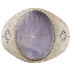 Star sapphire 14k white gold ring with 2 diamond accents.