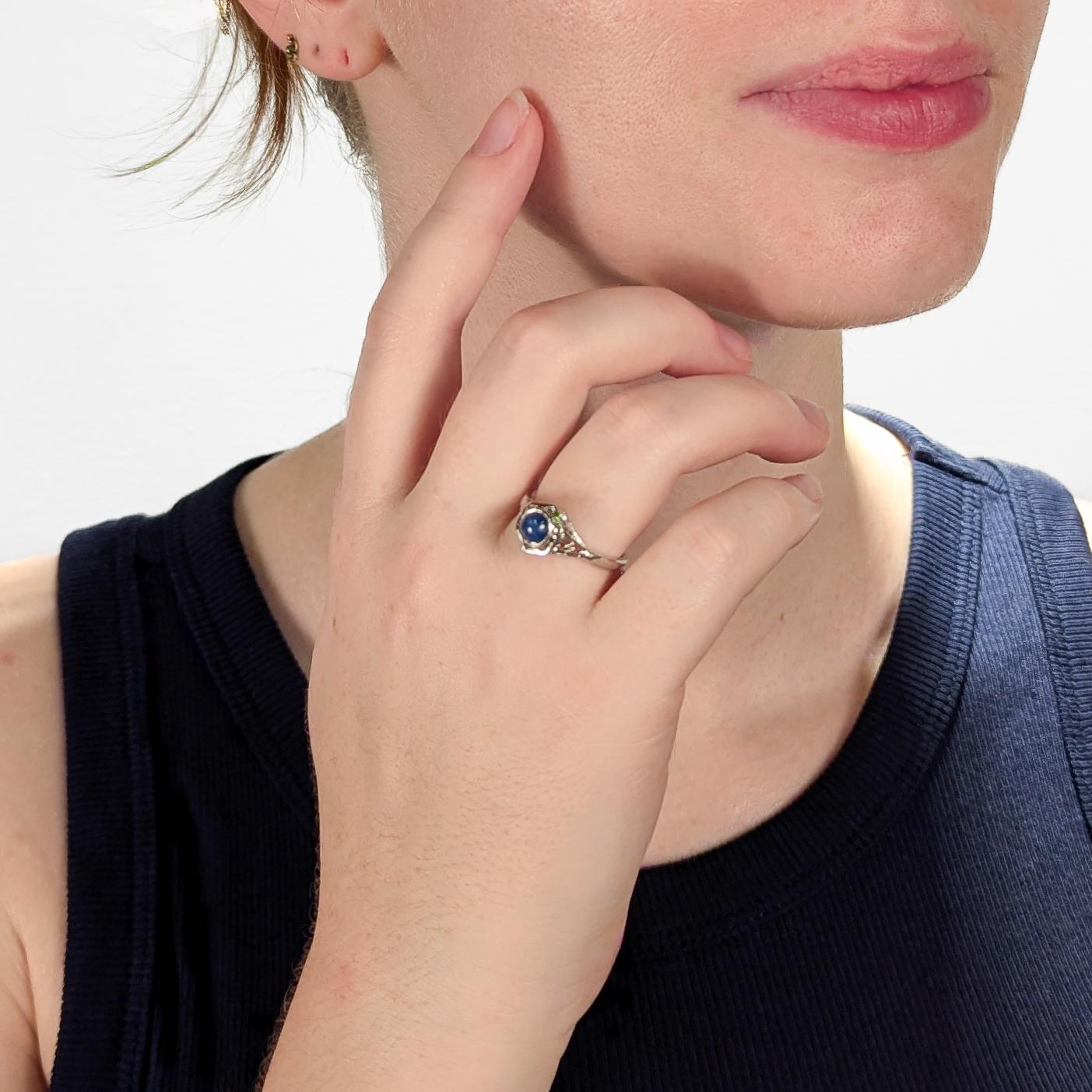 A fine Art Deco style ring.

In 14 karat white gold.

Bezel-set with a round star sapphire cabochon.

In a high-set filigree white gold setting.

Simply a wonderful Art Deco style ring!

Date:
20th Century

Overall Condition:
It is in overall good,