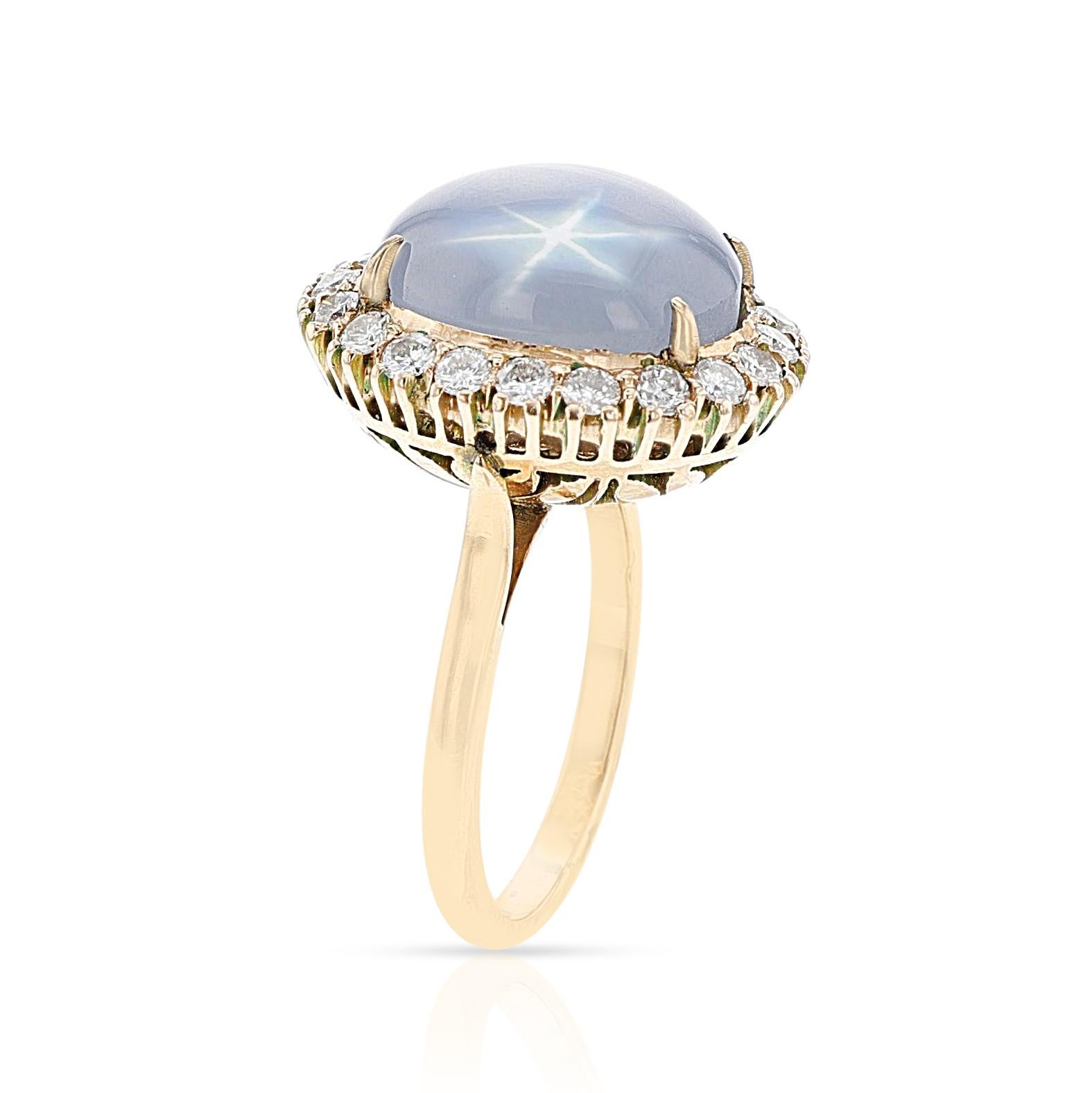 A Star Sapphire Cabochon and Diamond Halo Ring made in gold. The ring weighs 8.42 grams. The Ring Size is US 6.50. 

SKU: 1532