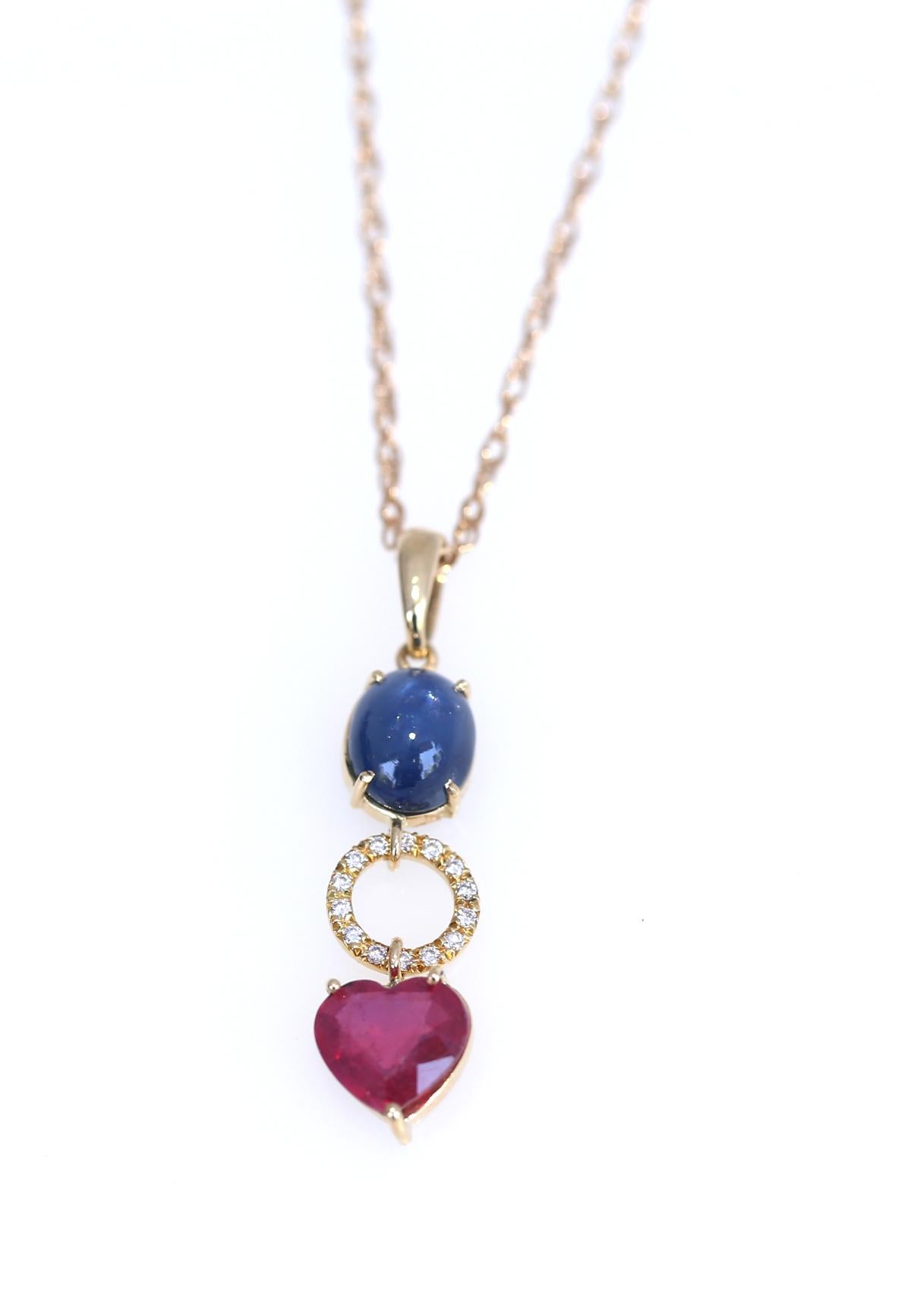 A fine combination of Star Sapphire Cabochon Diamonds Ring in the middle and a Ruby Heart. Different in shape and colour the composition is very joyfull. 
It was created in the 1950es when designers wanted to bring beauty to the world. A really fine