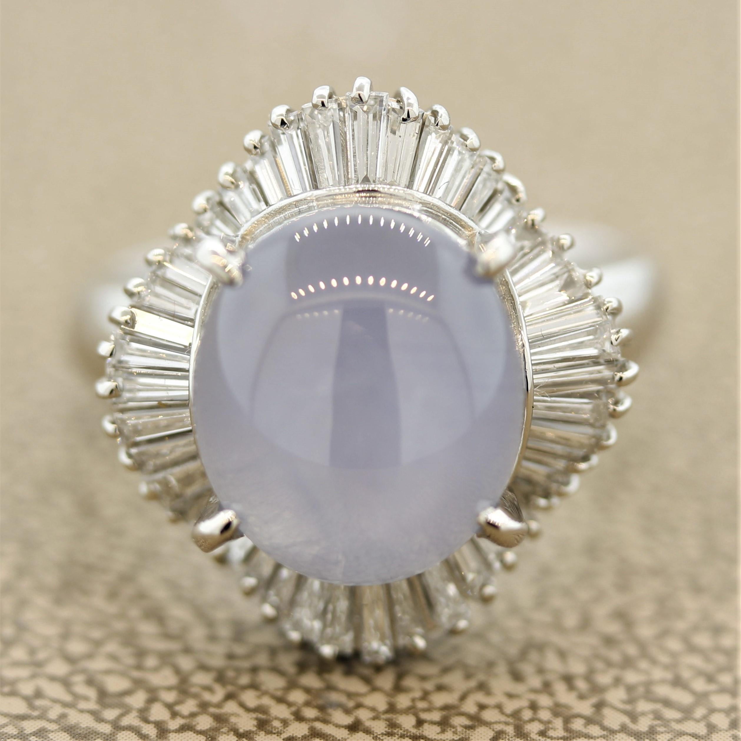 A classic ballerina styled ring featuring a 9.20 carat star sapphire. It has a soft blue color and when a light shines on the stone a six rayed star can be seen on it (called asterism). It is accented by 0.95 carats of baguette cut diamonds which