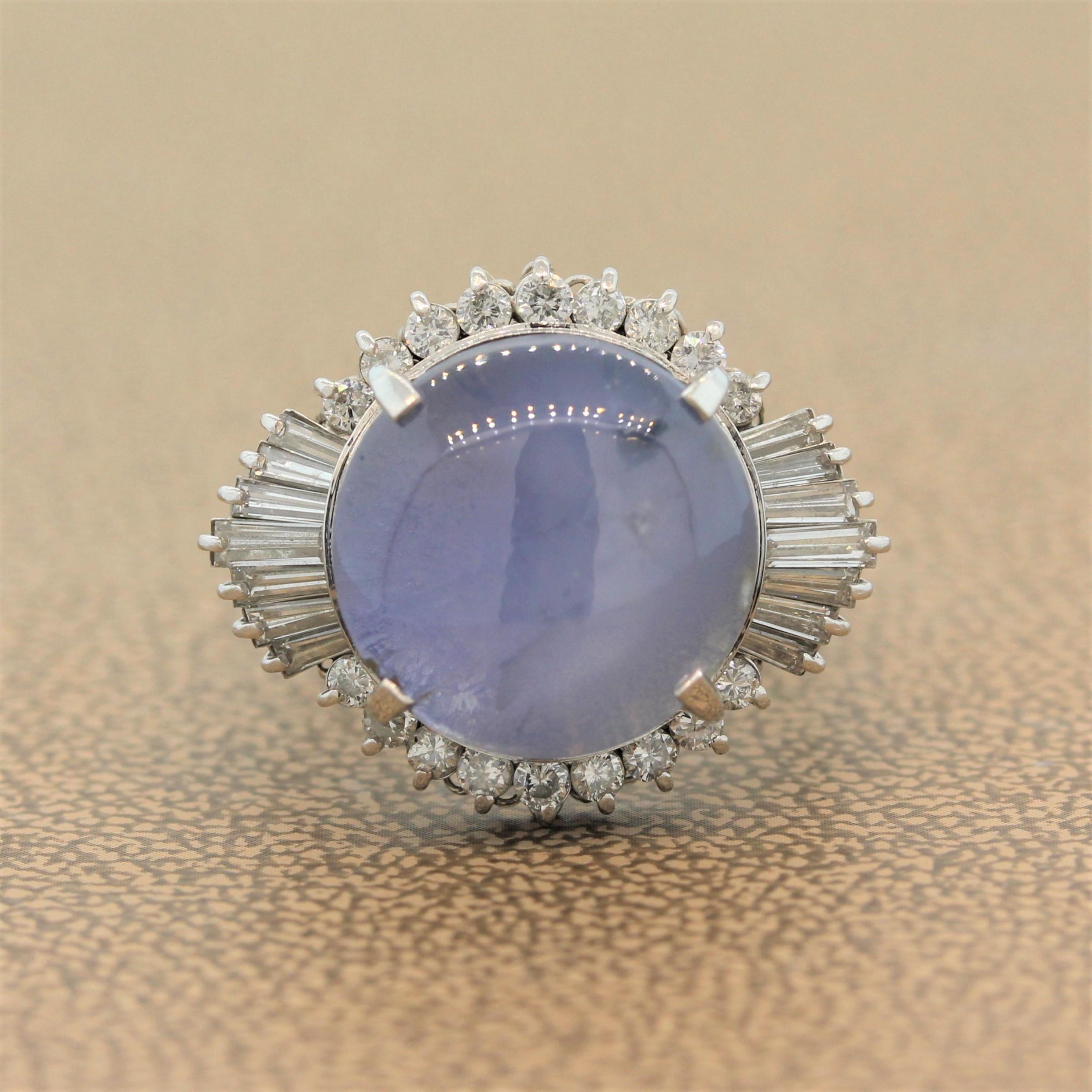 Star light star bright! A stunning 12.98 carat star sapphire is featured in this platinum ring. With 0.89 carats of round cut and baguette cut diamonds haloing the precious cabochon gemstone, this is a well-made ring with high quality stones.

Ring