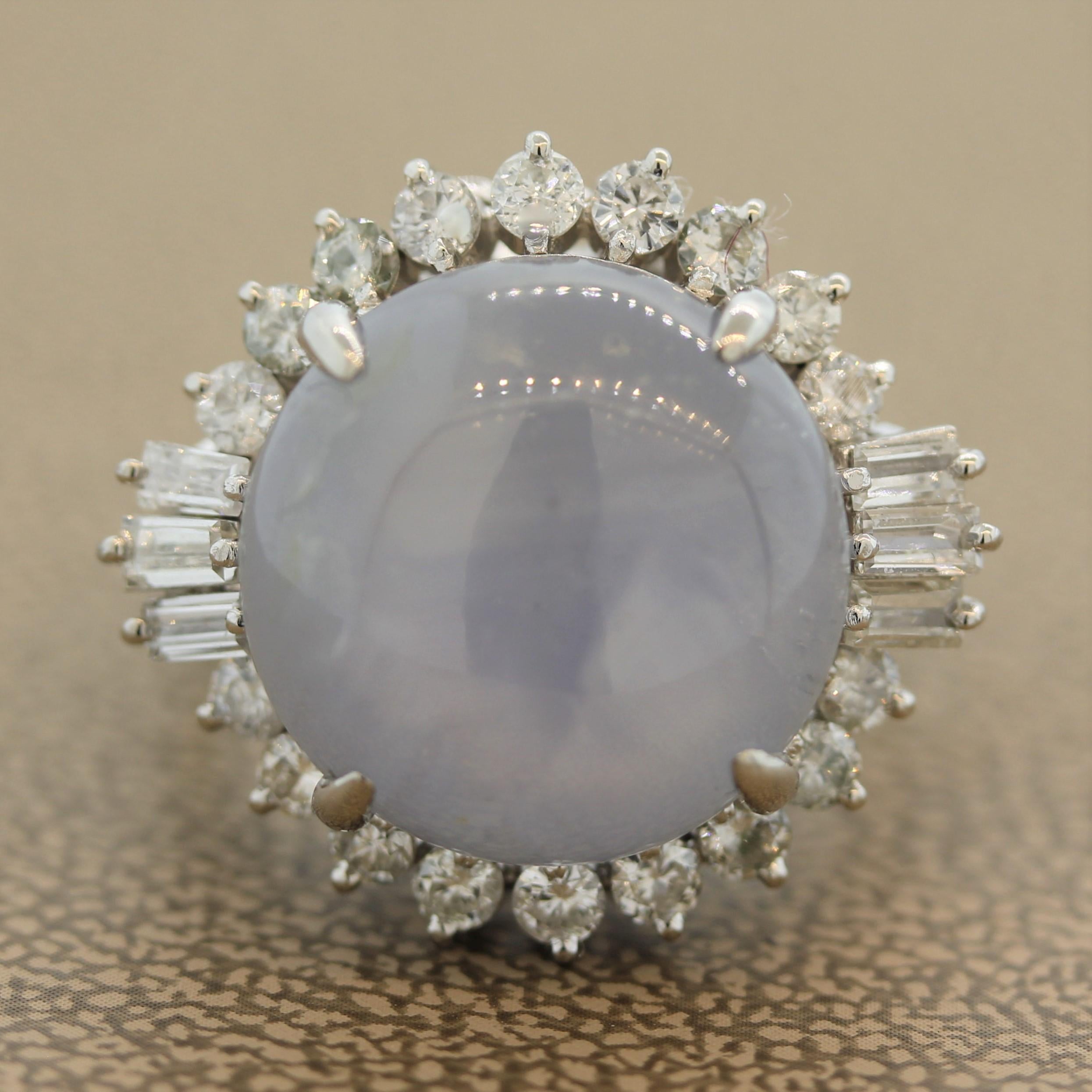 A classic star sapphire ring. The sapphire weighs 18.45 carats and features a superb strong 6-rayed star known as “asterism” which is only seen in some sapphires. It is surrounded by a mix of round brilliant and baguette cut diamonds weighing a