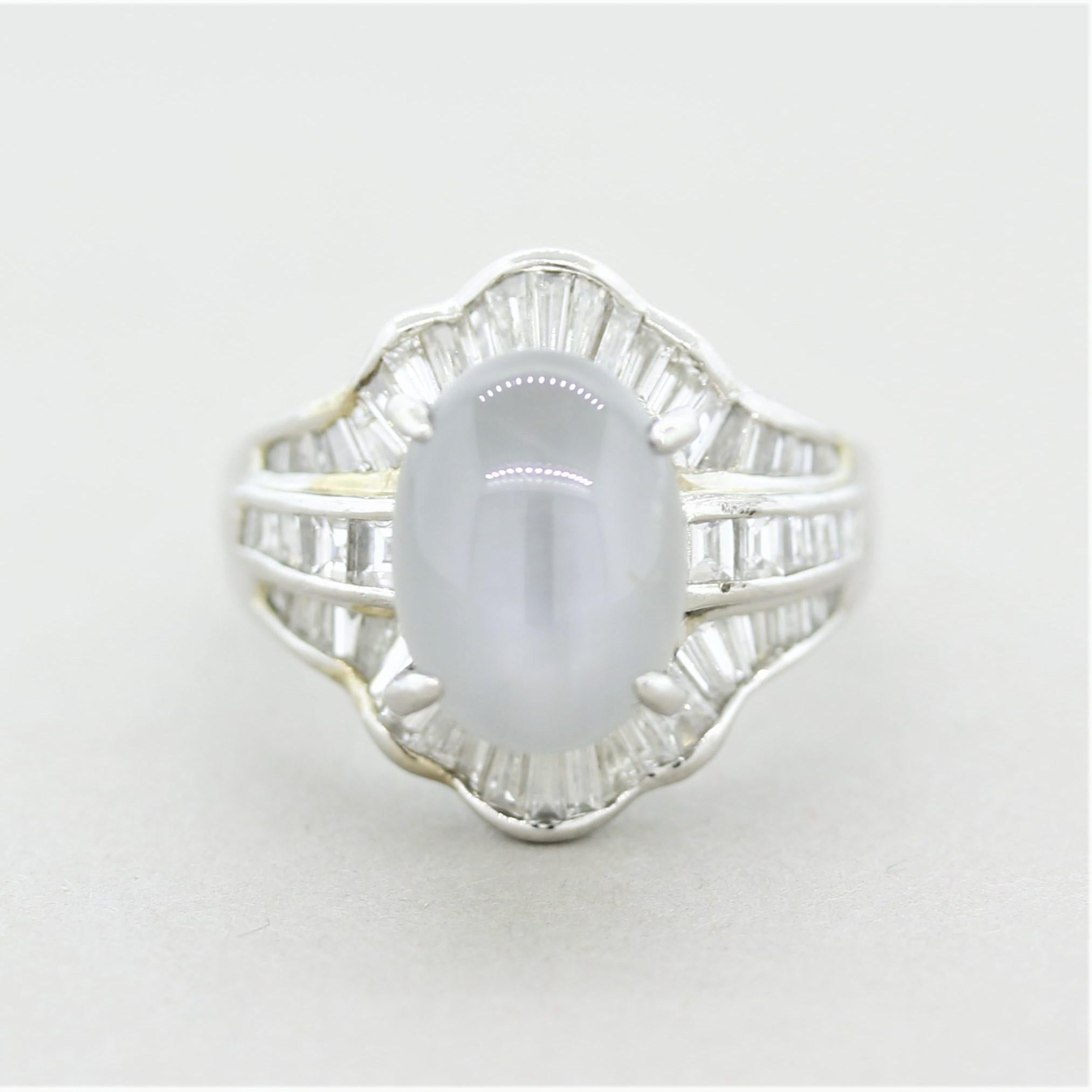 A fine platinum ring featuring a 8.26 carat star sapphire. The sapphire has a unique soft gray color and a lovely six-rayed star when a light hits the top of the stone. It is further accented by 1.38 carats of square-shaped and baguette-cut diamonds