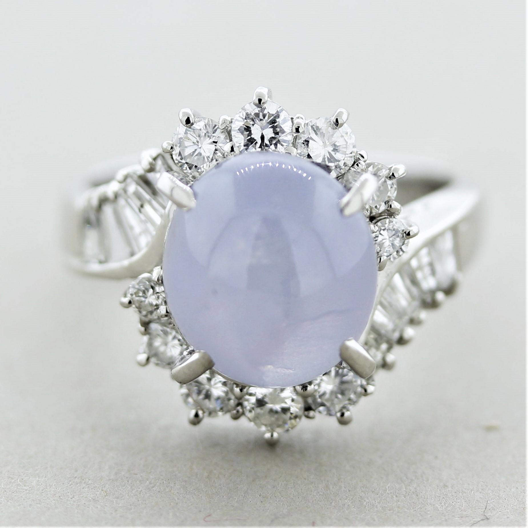 A fine star sapphire and diamond ring made in platinum. The sapphire weighs 6.03 carats and has a soft grayish-blue color. A very strong and prominent star, known as asterism, can be seen across the top of the sapphire as a light hits it or if under