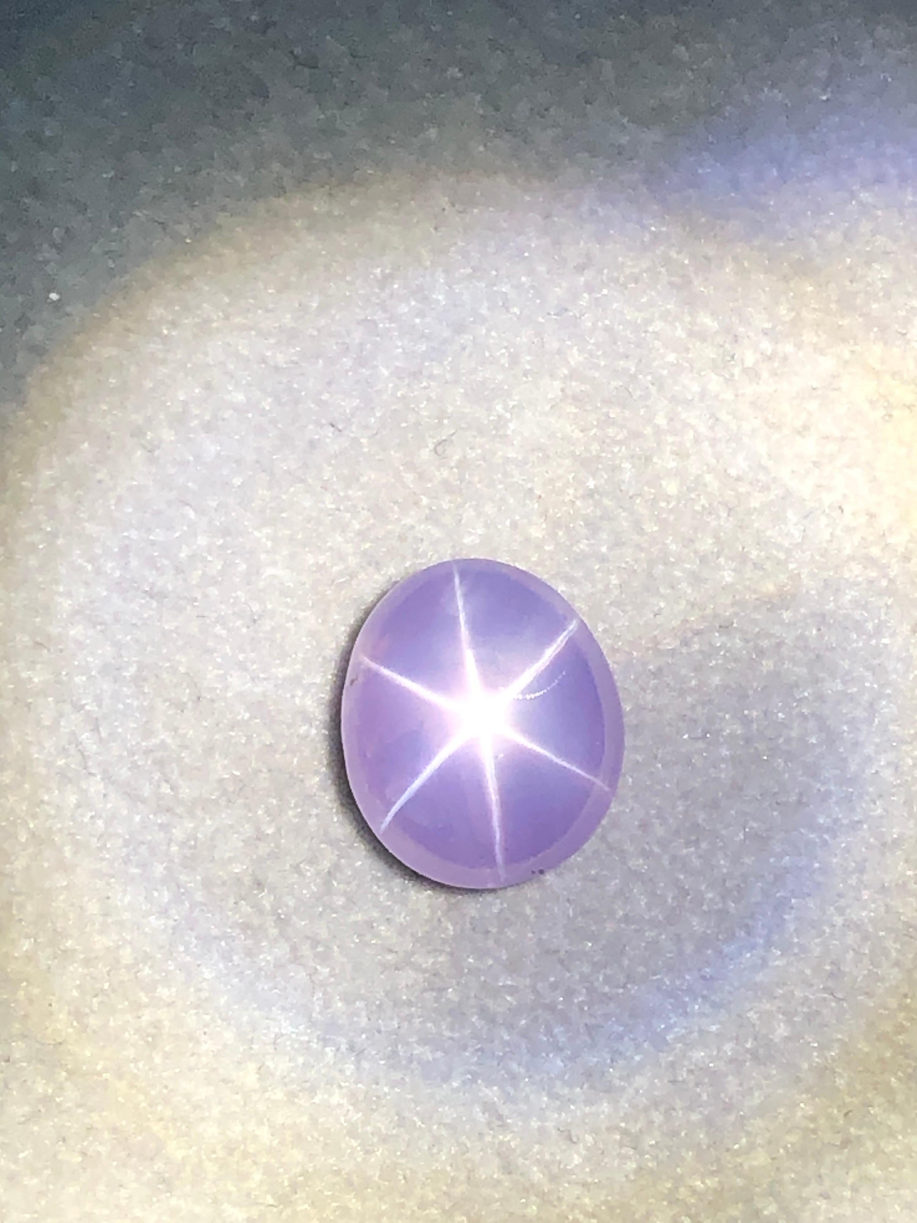 G.I.A certified, 8.60 carat, natural, unheated Ceylon Star Sapphire, oval cabochon gem, displaying a pinkish purple color, offered loose. This gem would make a very unique unisex ring or pendant.
We offer supreme fine custom jewelry work upon