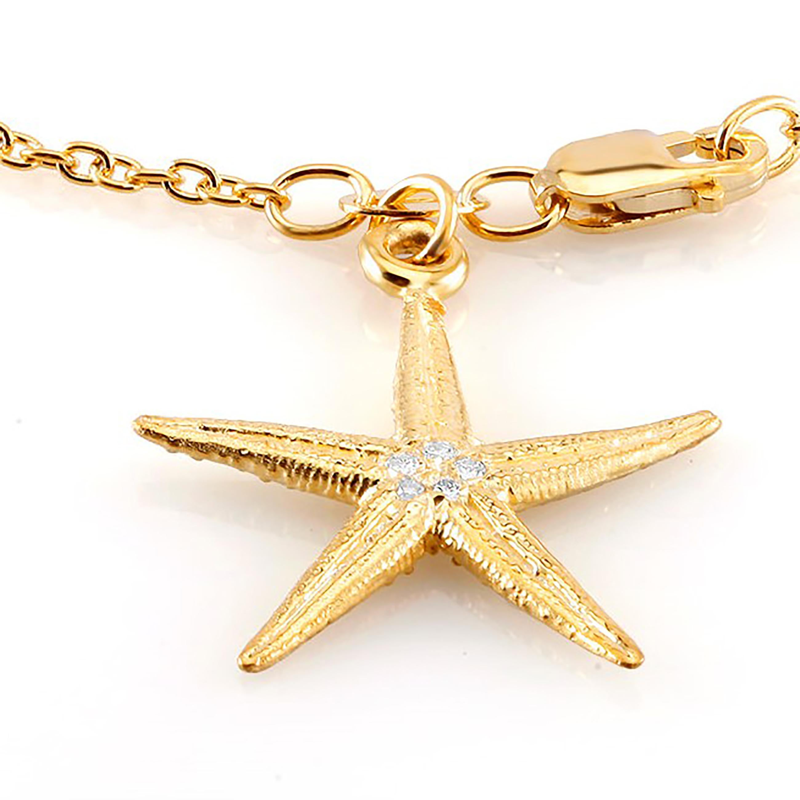 Sterling Silver link bracelet 
Star shape diamond charm measuring one inch
Lobster claw clasp
Four diamond weighing 0.10 carat 
Bracelet seven inch long 
New bracelet
Yellow gold plated 
