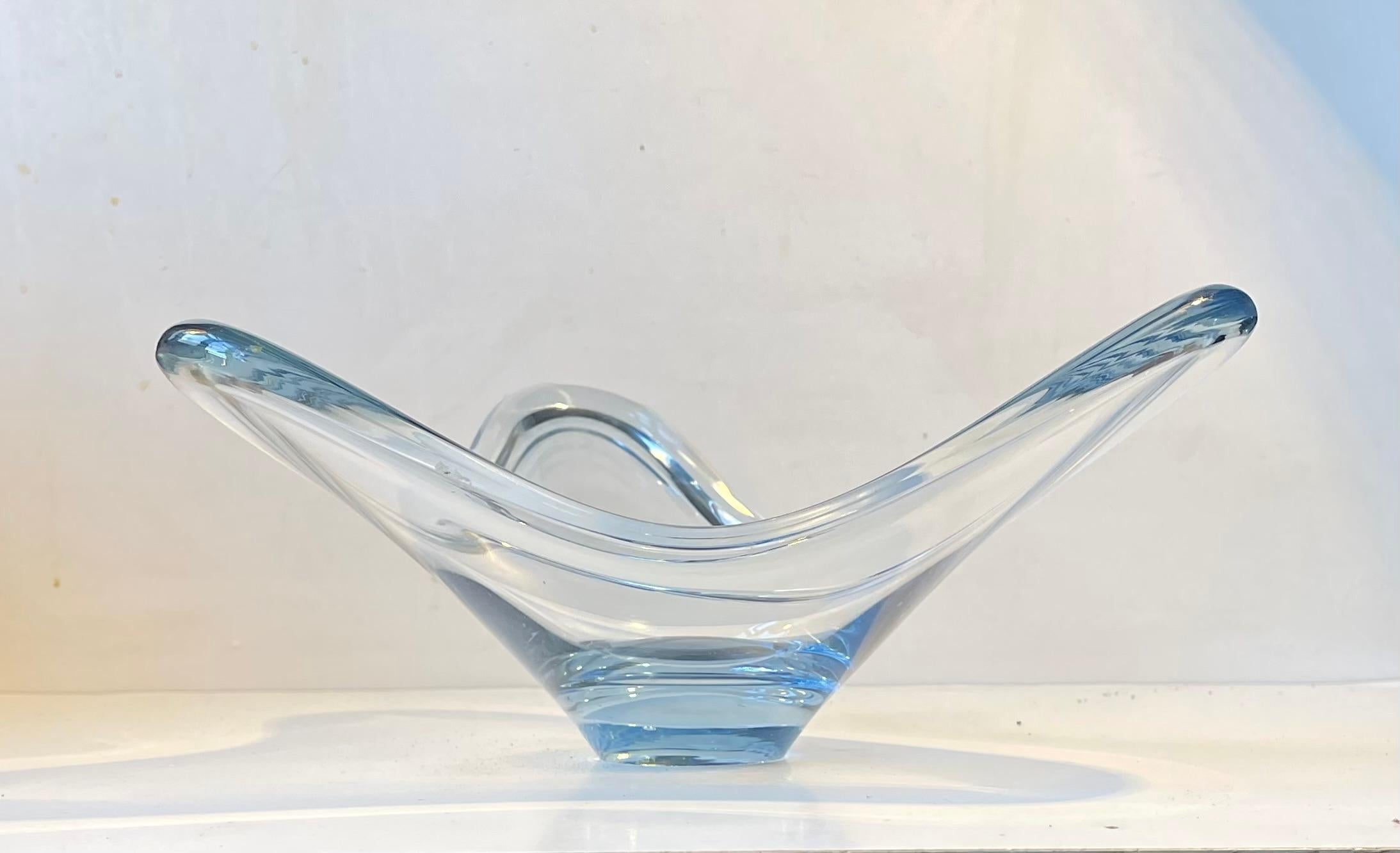 Twi-star shaped aqua blue bowl designed by Per Lütken in 1964. Manufactured at Holmegaard in Denmark during the mid-late 1960s. It is called Aqua or Fionia and it is signed PLS by the designer to its base. Measurements: H: 15.5 cm, W/D: 29/30 cm.