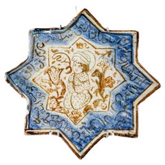 Piastrella di ceramica a forma di stella, probabilmente di scuola persiana