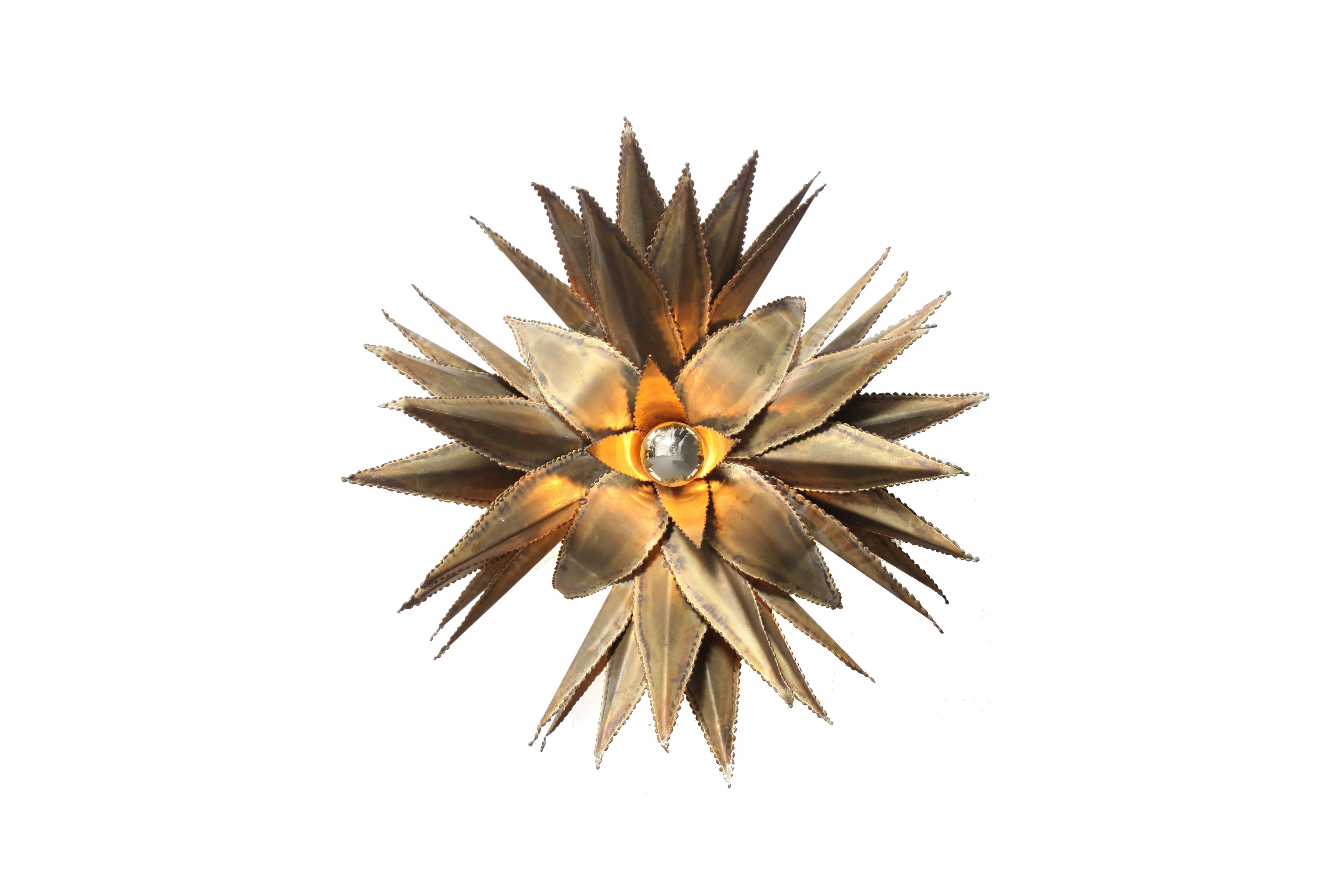 Hollywood Regency handmade fixtures.
Brass star shaped palm tree wall light, custom made for a Belgian hotel in the 1970s.
 