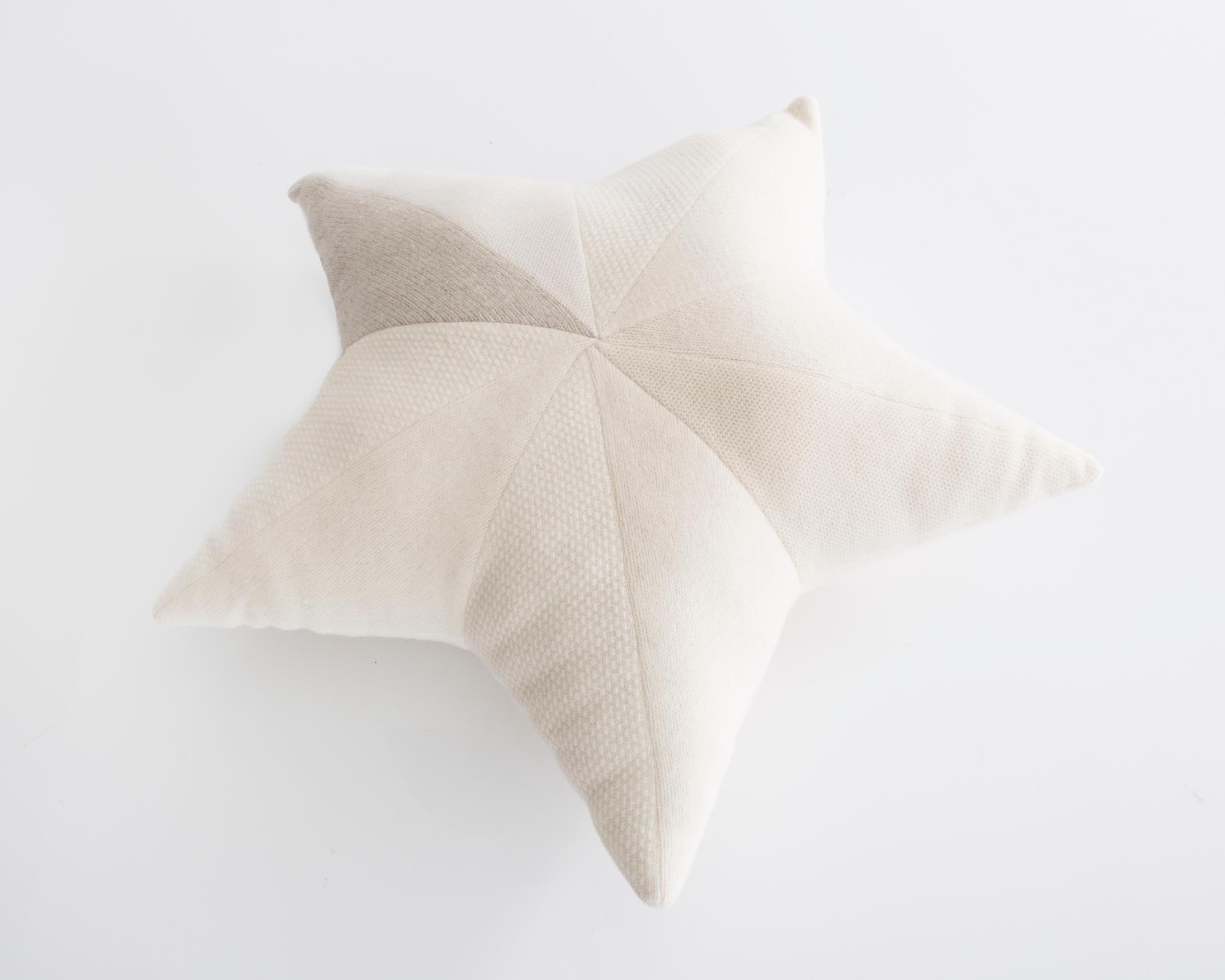 Unique star-shaped patchwork pillow in white cashmere. Designed and made by Greg Chait, USA, 2017.