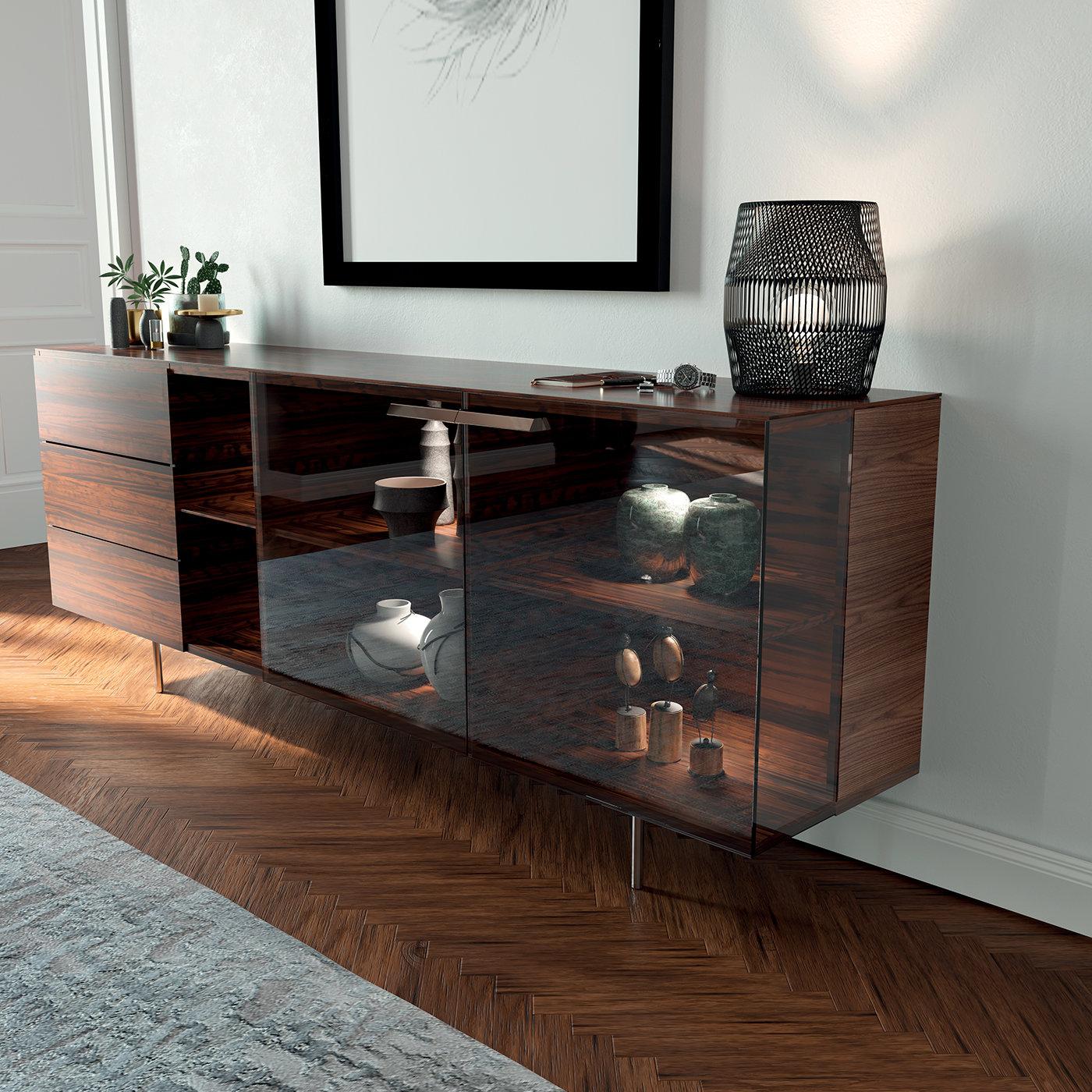 A stylish and functional furnishing item, the Star Sideboard, by Cesare Arosio has been crafted with a structure and drawers in canaletto walnut and features glass doors and a base in painted metal. With available finishes of canaletto walnut or