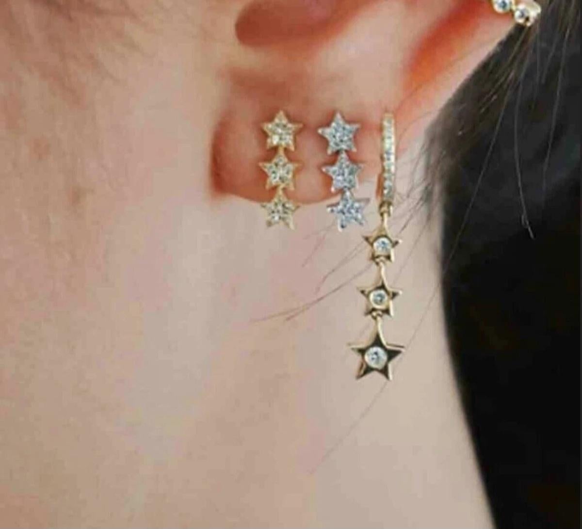 Orecchini a stella in oro massiccio 14K per donne Orecchini d'oro fatti a mano.

Numero di diamanti
36
Forma
Stella
Chiusura
Farfalla
Colore della pietra principale A. Stone
Bianco
Metallo
Oro giallo
Articolo Lunghezza
12 mm circa
Pietra