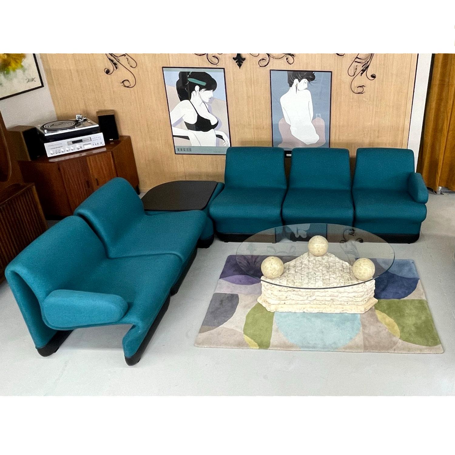 We can neither confirm nor deny that these Paul Boulva modular seating group has seen screen time on Start Trek: The Next Generation, but the teal color resemblance to the Ten Forward chairs is uncanny. The iconic show aired during the 1987-1994