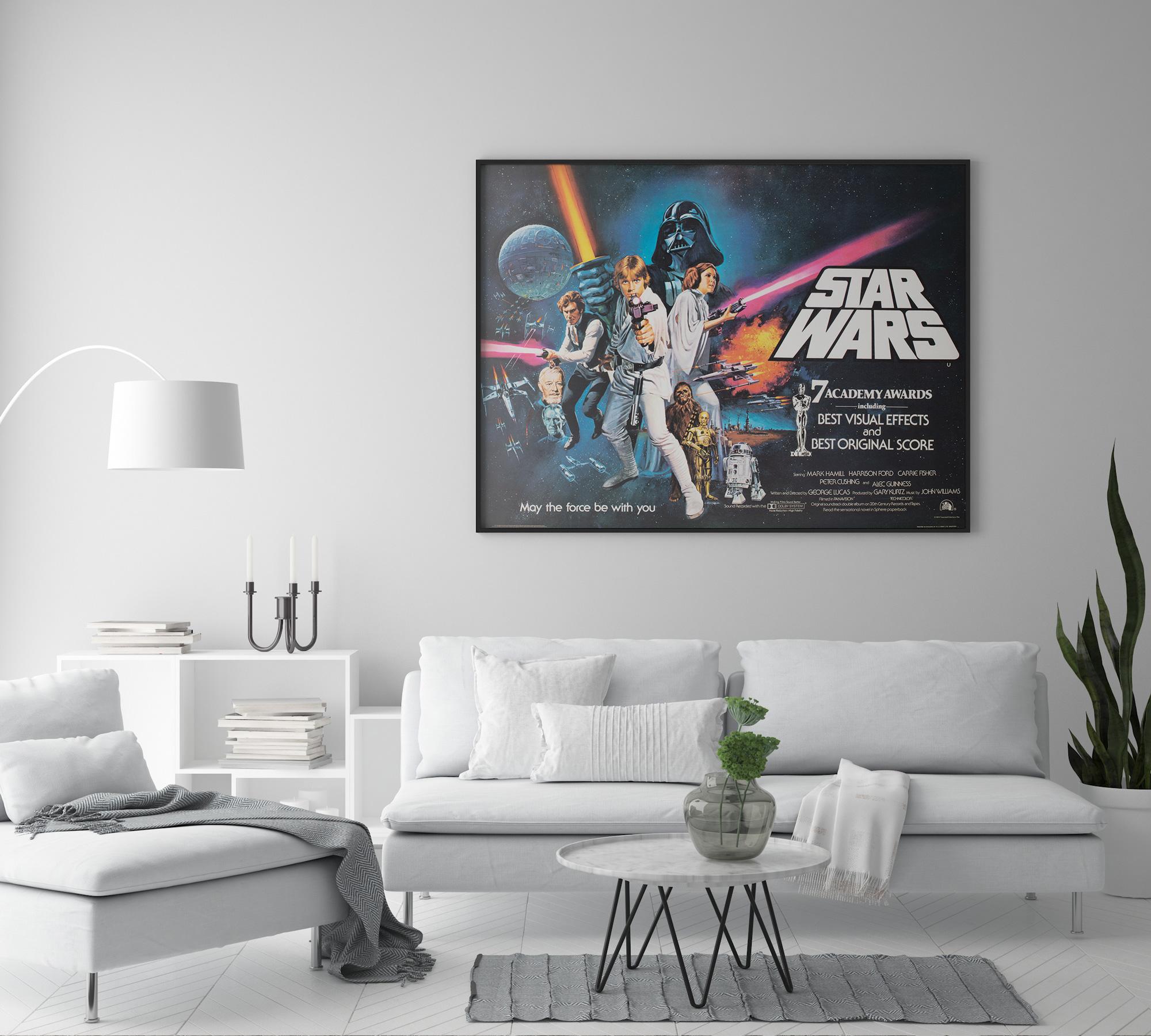The fabulous Star Wars Style C Quad Oscars film poster with the iconic artwork by Tom Chantrell. Chantrell was tasked with enhancing the star appeal and the merchandising opportunities for Fox and George Lucas and he certainly delivered with this