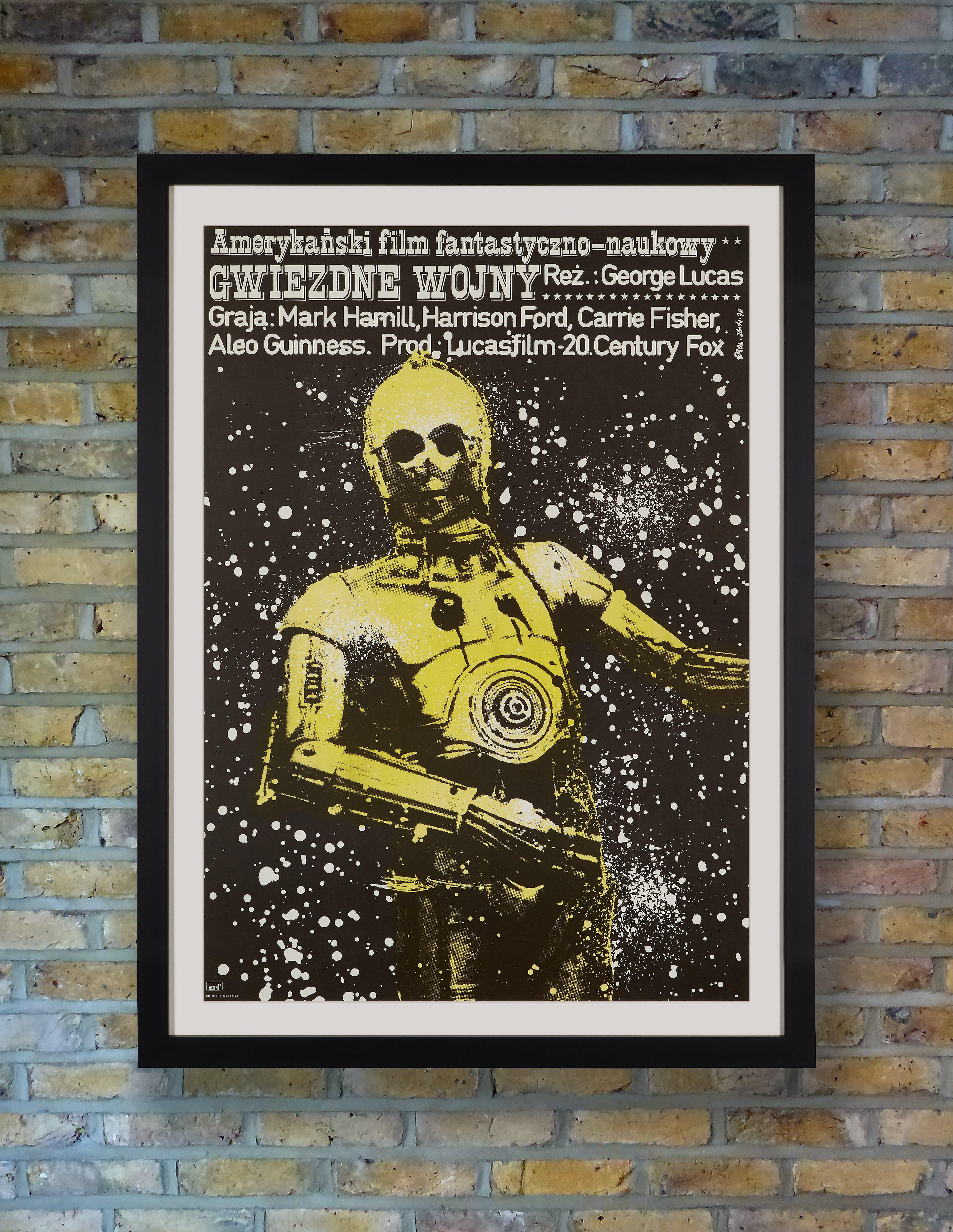Jakob Erol's extraordinary design for the first release of Star Wars in Poland in 1979 focuses on a haunting image of C-3P0 against a splattered galaxy. The title lettered in a western style font reflects the notion that Star Wars was a space