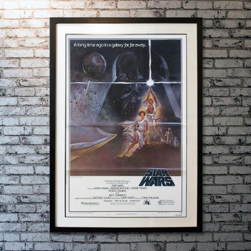 Star Wars, Unframed Poster, 1977

Original One Sheet (27 X 41 Inches). Luke Skywalker joins forces with a Jedi Knight, a cocky pilot, a Wookiee and two droids to save the galaxy from the Empire's world-destroying battle station, while also