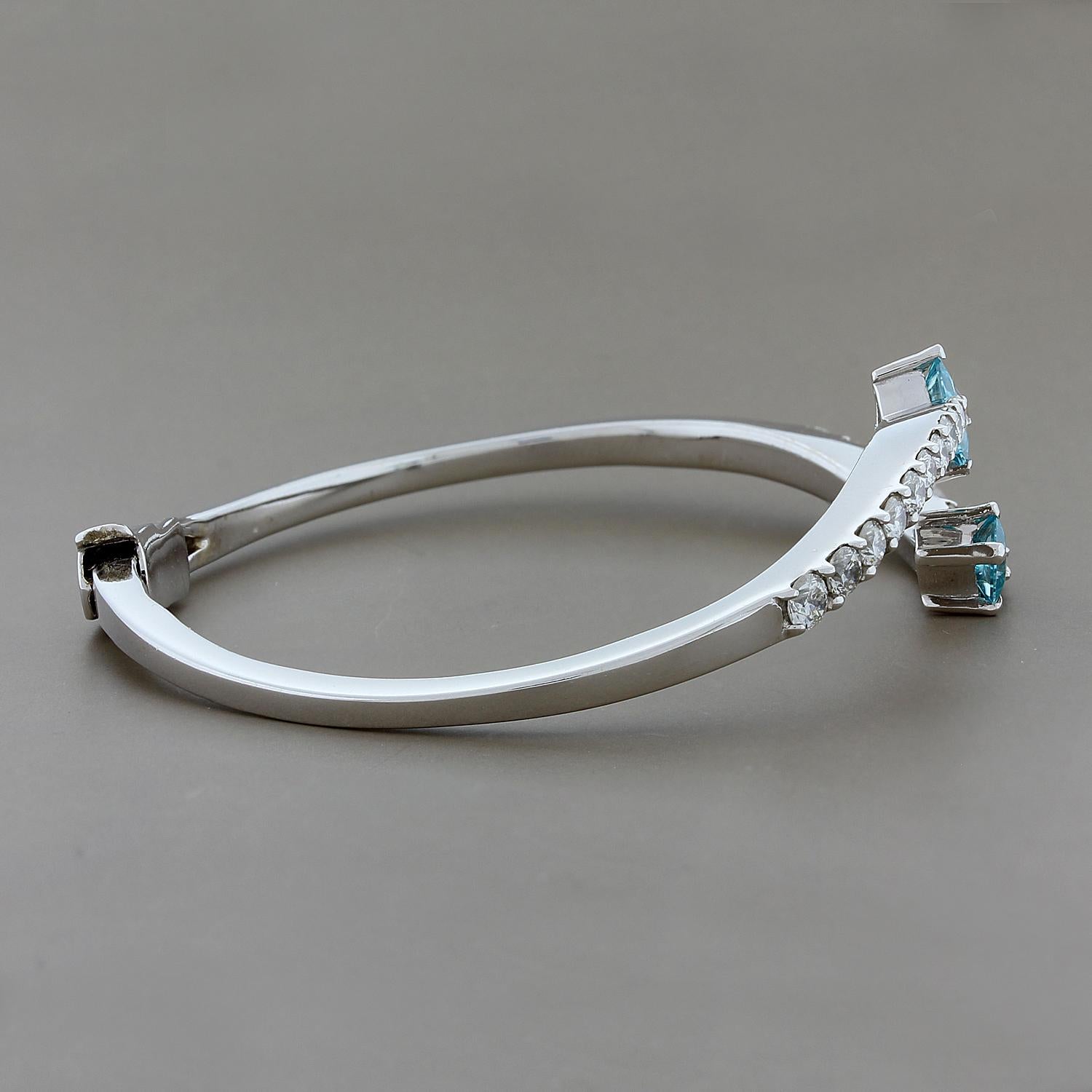 Shooting Star! This cuff features 1.49 carats of blue zircon. The two princess cut blue zircons are followed by 1.83 carats of round cut diamonds. The cuff has a safety latch for added security. Set in 14K white gold.

Fits wrists up to 6.5 inches
