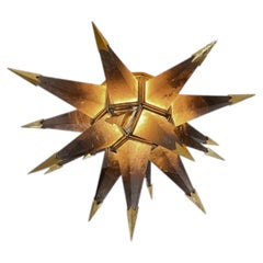 Eine „Smoky Rock Crystal Star“-Einbauleuchte und zwei „Bubble“-Wandleuchten von Phoenix