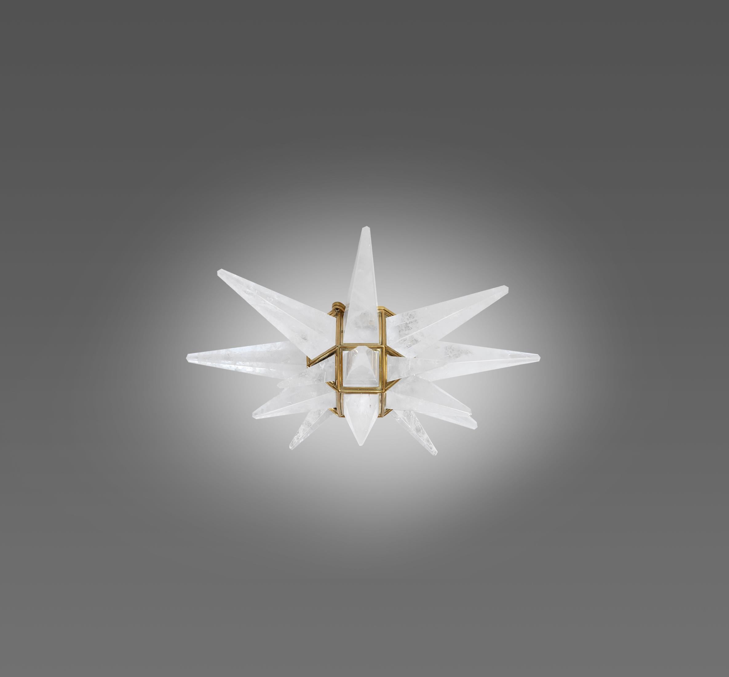 Star form rock crystal flushmount with polish brass frame. Created by Phoenix Gallery, NYC.
Two e12 sockets installed.
120w total 