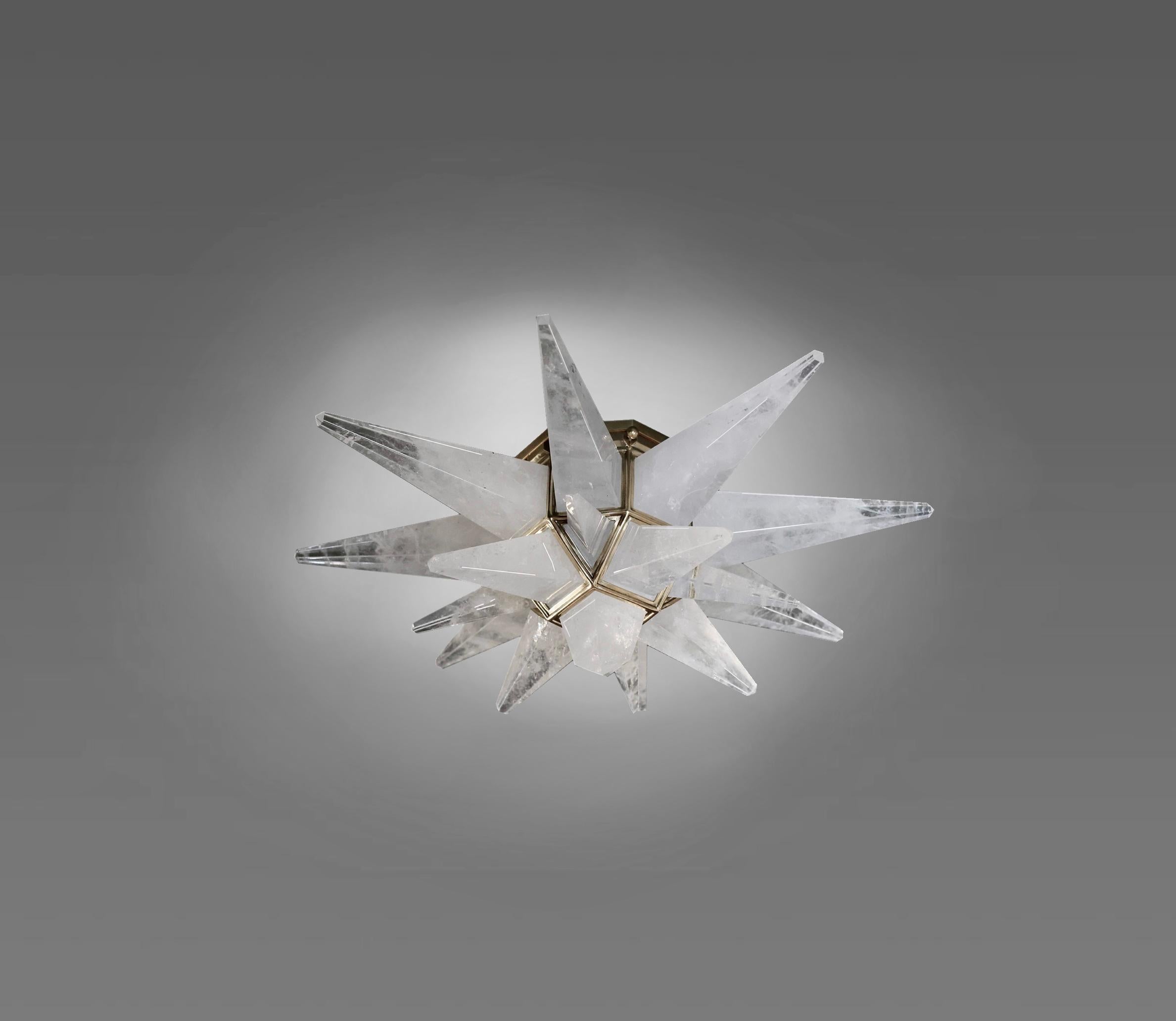 A group of three stars forms rock crystal flush mountain with polished brass frames. Each Flush mount install two candlelabra sockets.140 w total, crated by phoenixgallery.