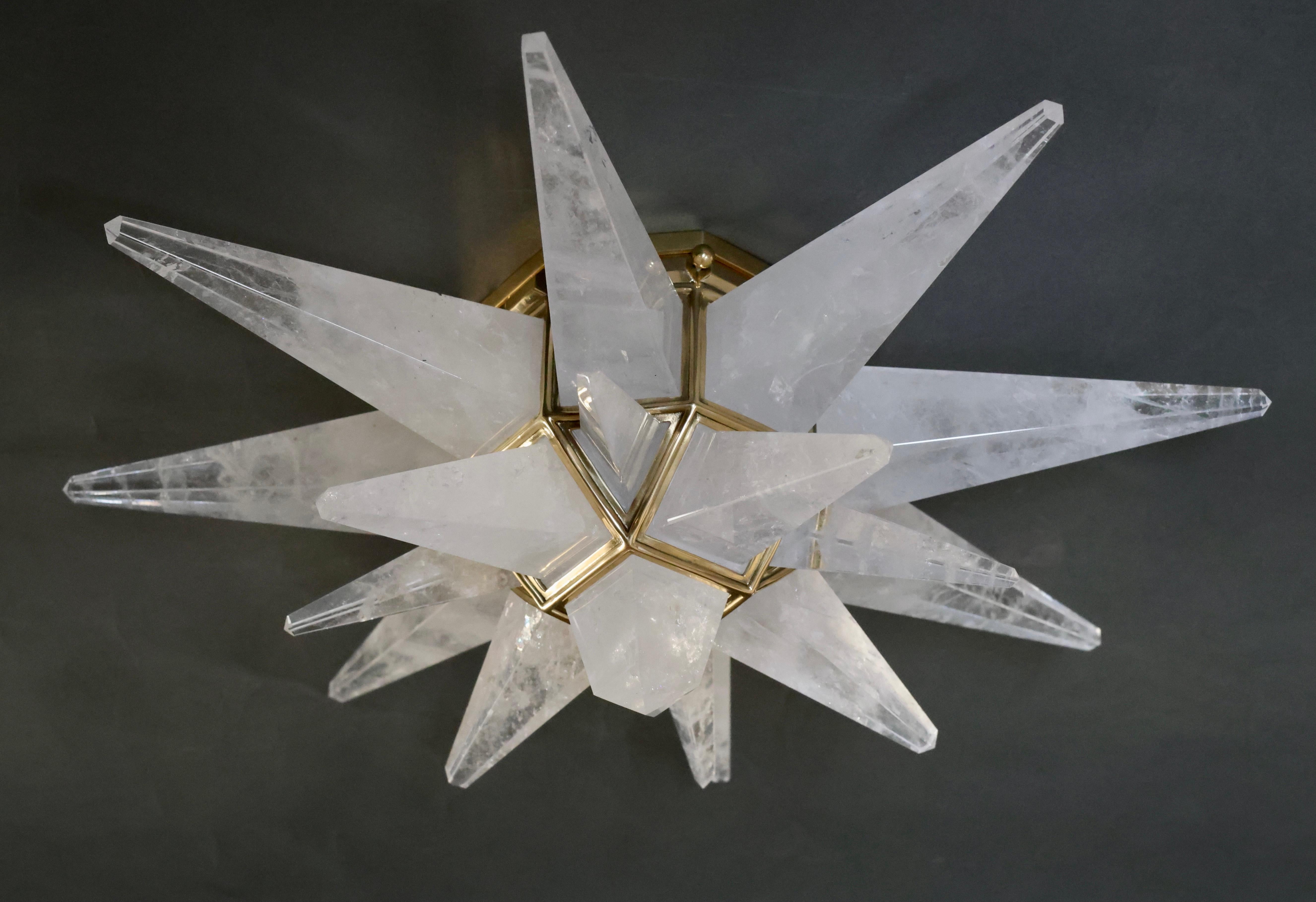 Star form rock crystal flush mount with polish brass frame.
Each fixture installed two sockets. Crated by Phoenix gallery.