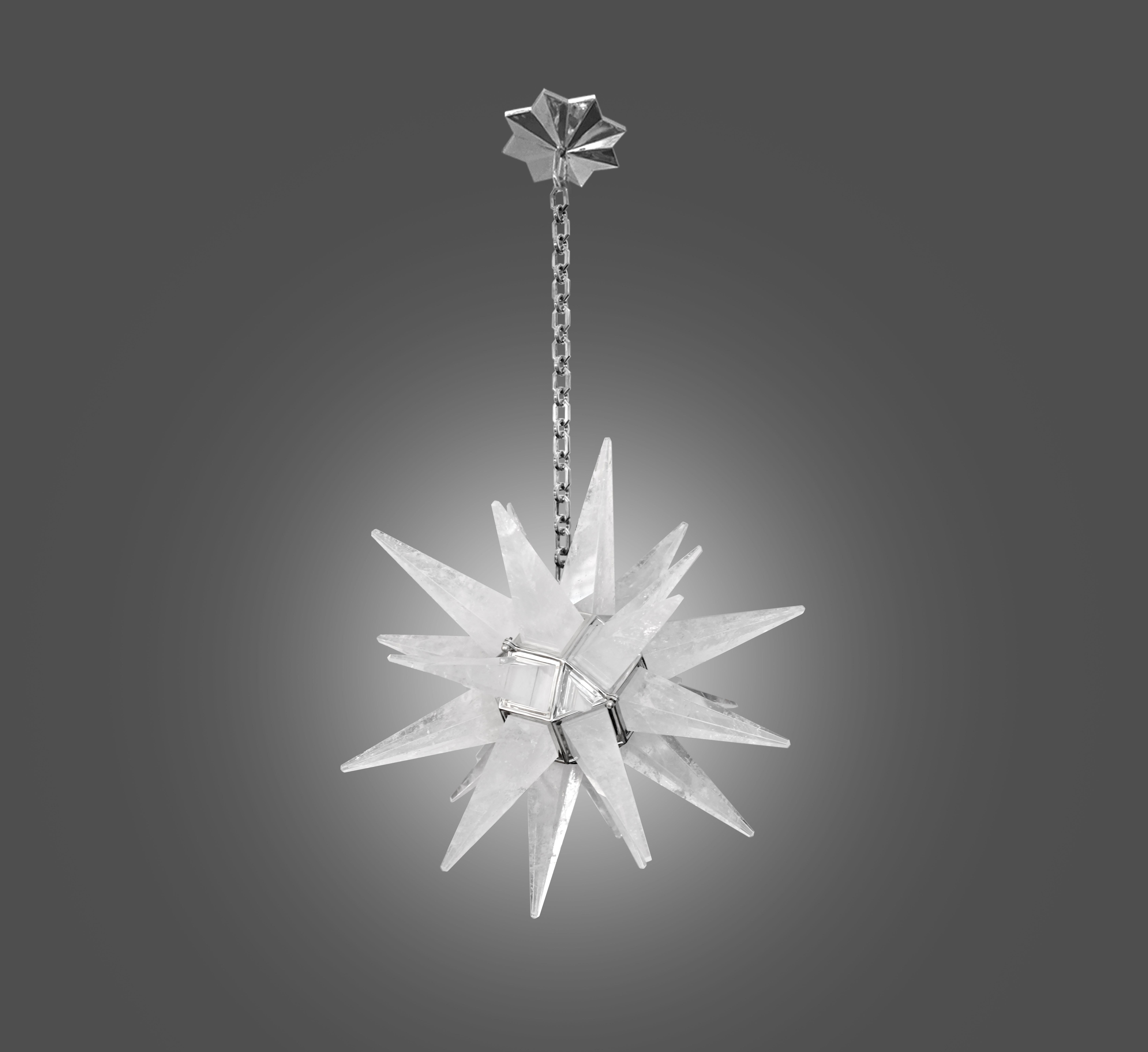 Large deco style star forms rock crystal chandelier with polish nickel frame. 2 sockets installed. Use two 100 watts led warm light bulbs. The total is 200 watts. The metal finish available in polish brass and antique brass.
The chandelier is 32