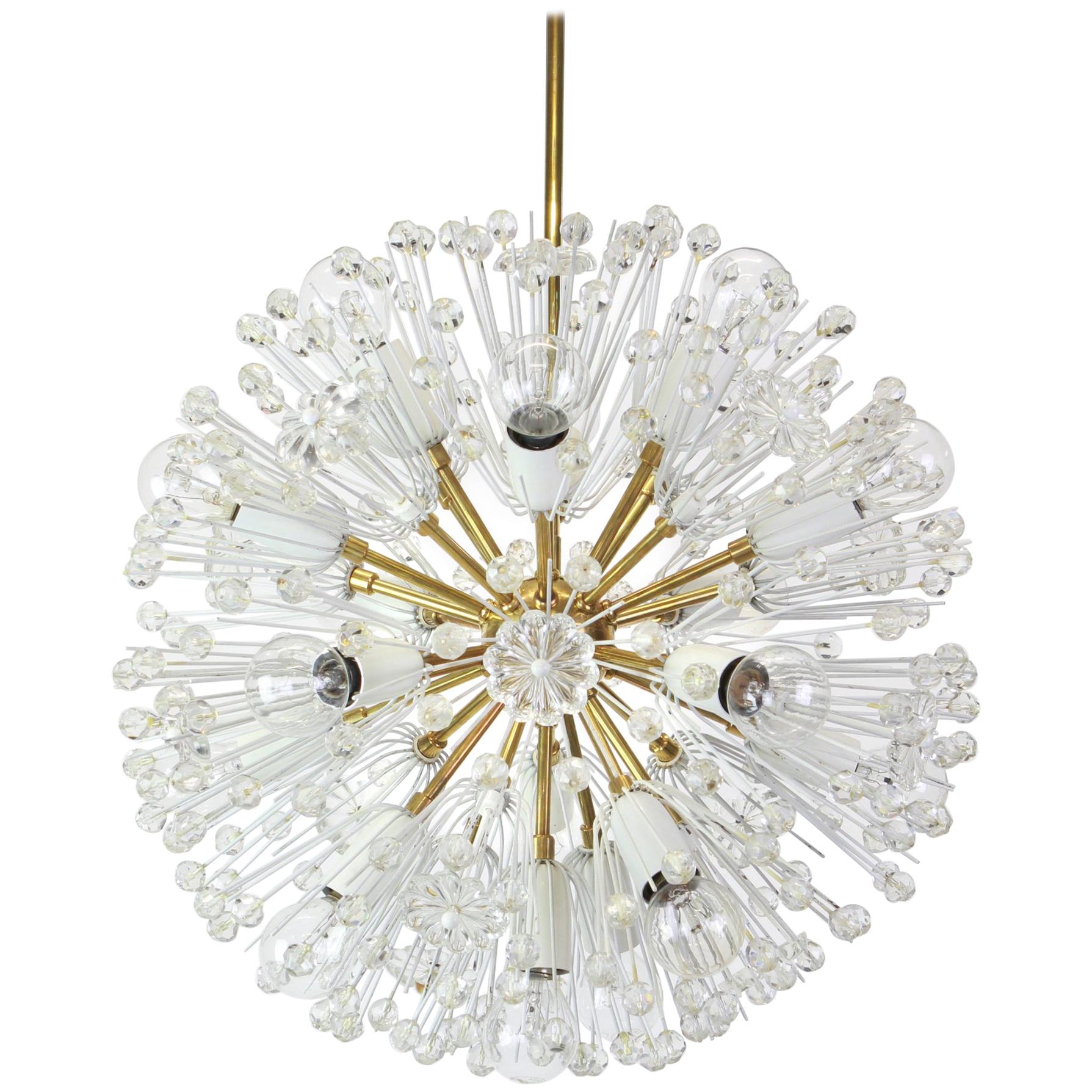 Beautiful large starburst brass chandelier with hundreds of crystals designed by Emil Stejnar for Nikoll, manufactured in Austria, circa 1960s.

Heavy quality and in good condition with small signs of age.
Cleaned, well-wired and ready to use.