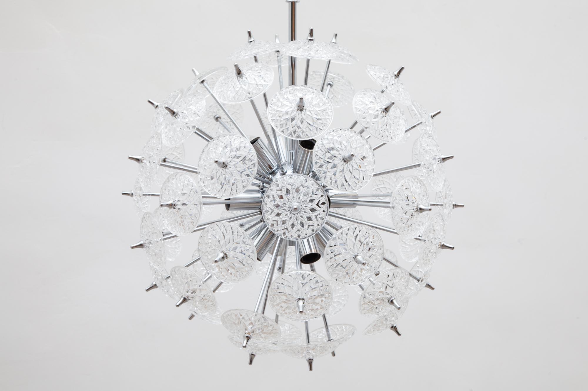 Belgium manufacture Val Saint Lambert sputnik crystal discs chandelier in silver finish. This stunning piece has a high-quality chrome base with many crystals cut circles of glass flowers creating beautiful light.
Lit by 12 bulbs.
 
