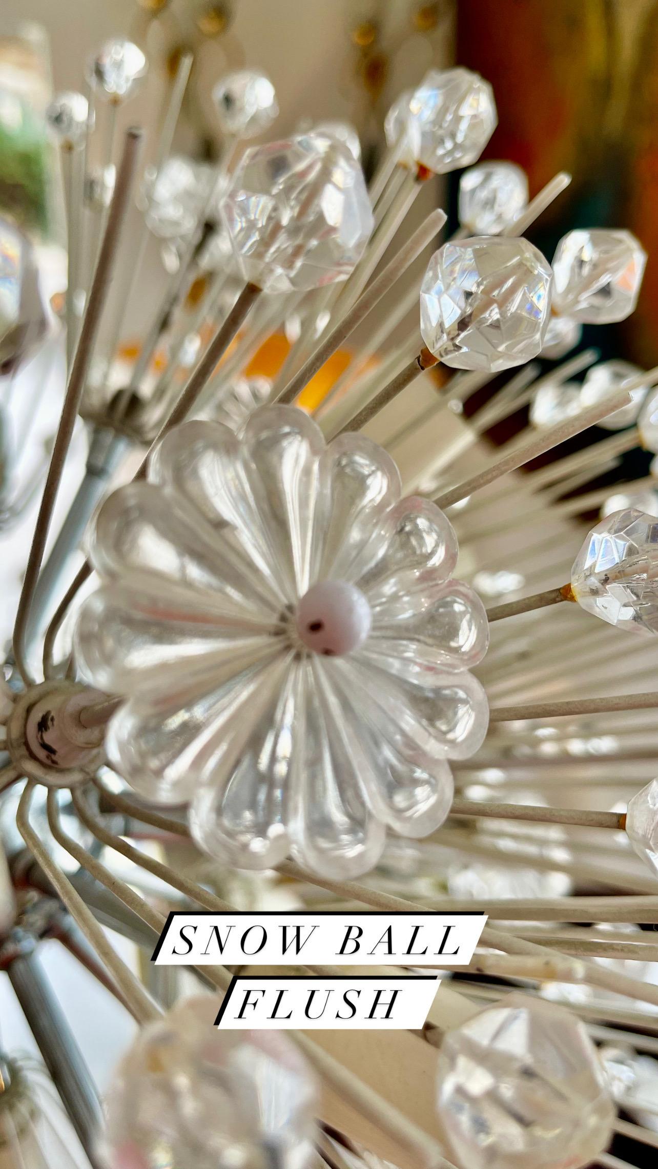 Exceptional large star chrome chandelier with hundreds of lucite crystals designed by Emil Stejnar for Nikoll, made in Austria, circa 1960s.

High Quality and in good condition with small signs of age. Cleaned, well wired and ready to use. The