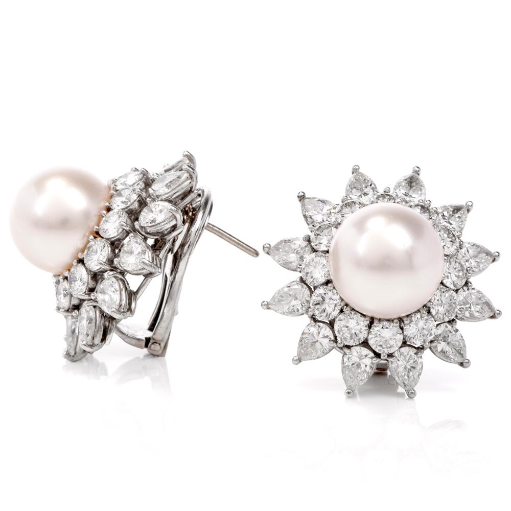 This fabulously elegant pair of estate Diamond & Pearl earrings are crafted in solid platinum weighs 27.9 grams. These Chic earrings display a stunning starburst of 24 pear-shaped and 24 round-cut high-quality diamonds weighing 14.50 carats, G-H