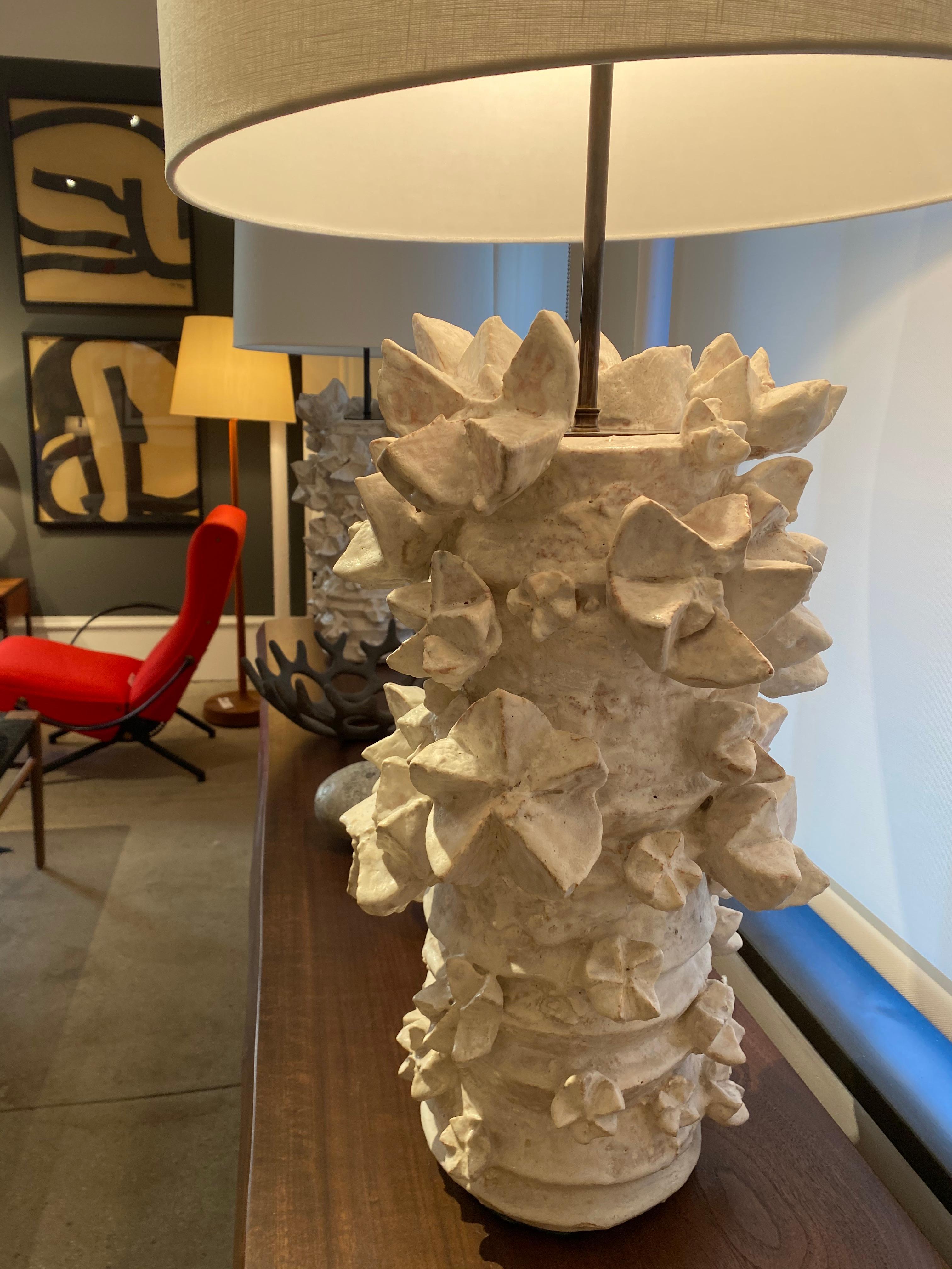Peter Lane is an American ceramic artist whose pieces act as both works of Fine Art and as anchors to interior spaces, Lane’s work fuses the functional with the fine. His oeuvre boasts a wide breadth of small pottery tableware, furniture, fireplace