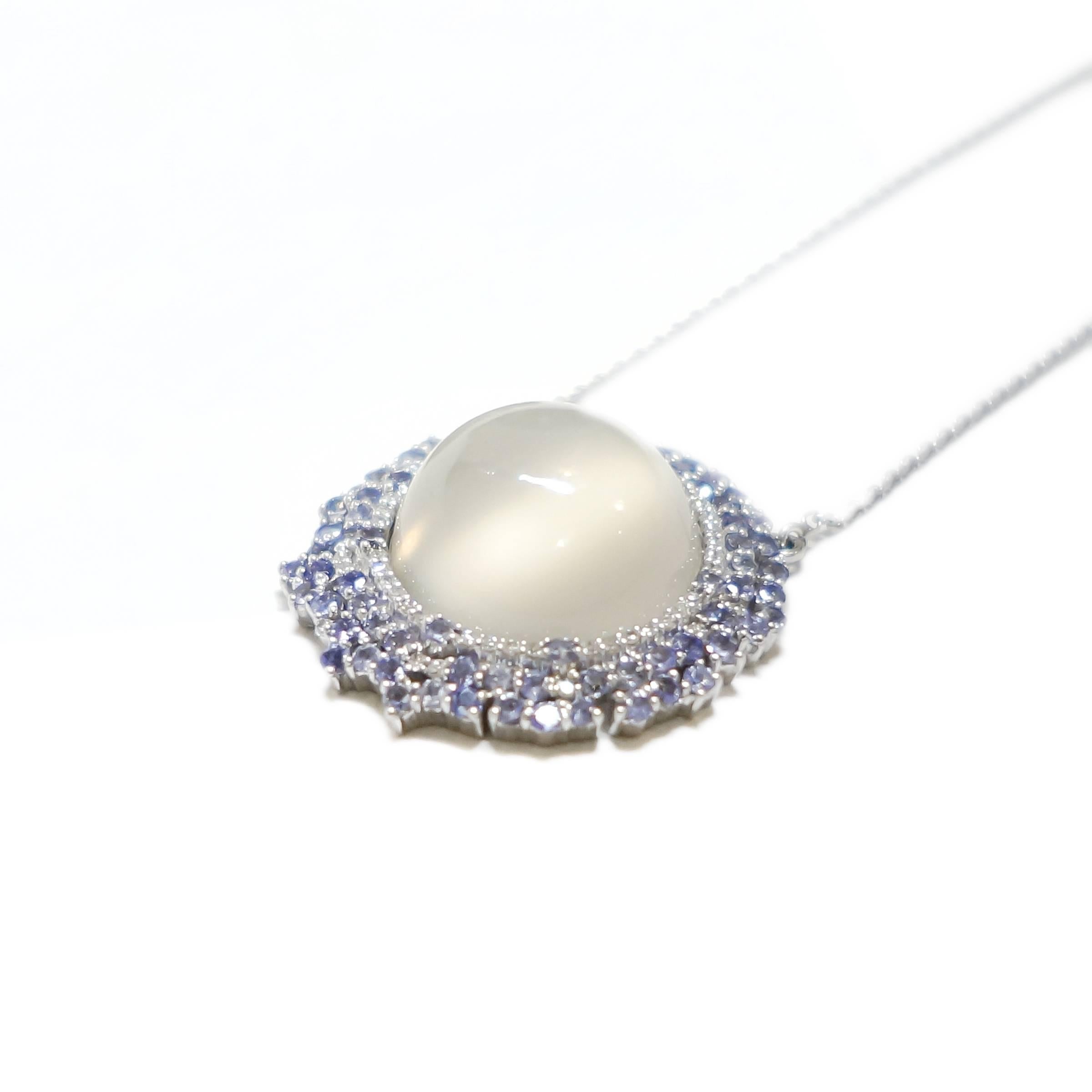 Uniquely mixing bold shapes with stunning gemstones, Ri Noor's Starburst Moonstone Tanzanite and Diamond Necklace is a captivating piece of jewelry with an ethereal quality. The necklace is anchored by a semispherical moonstone that glistens in the