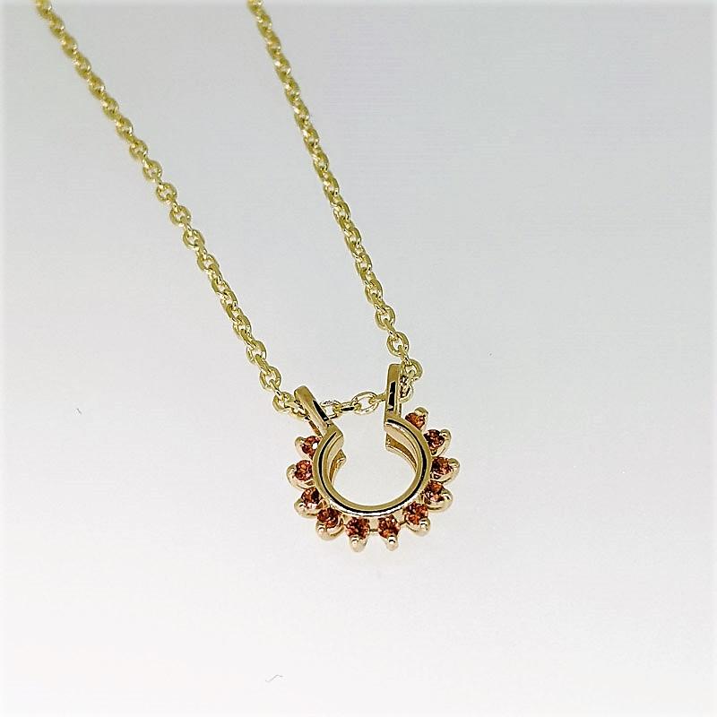 Round Cut Starburst Necklace in 14 Karat Gold and Orange Sapphires For Sale