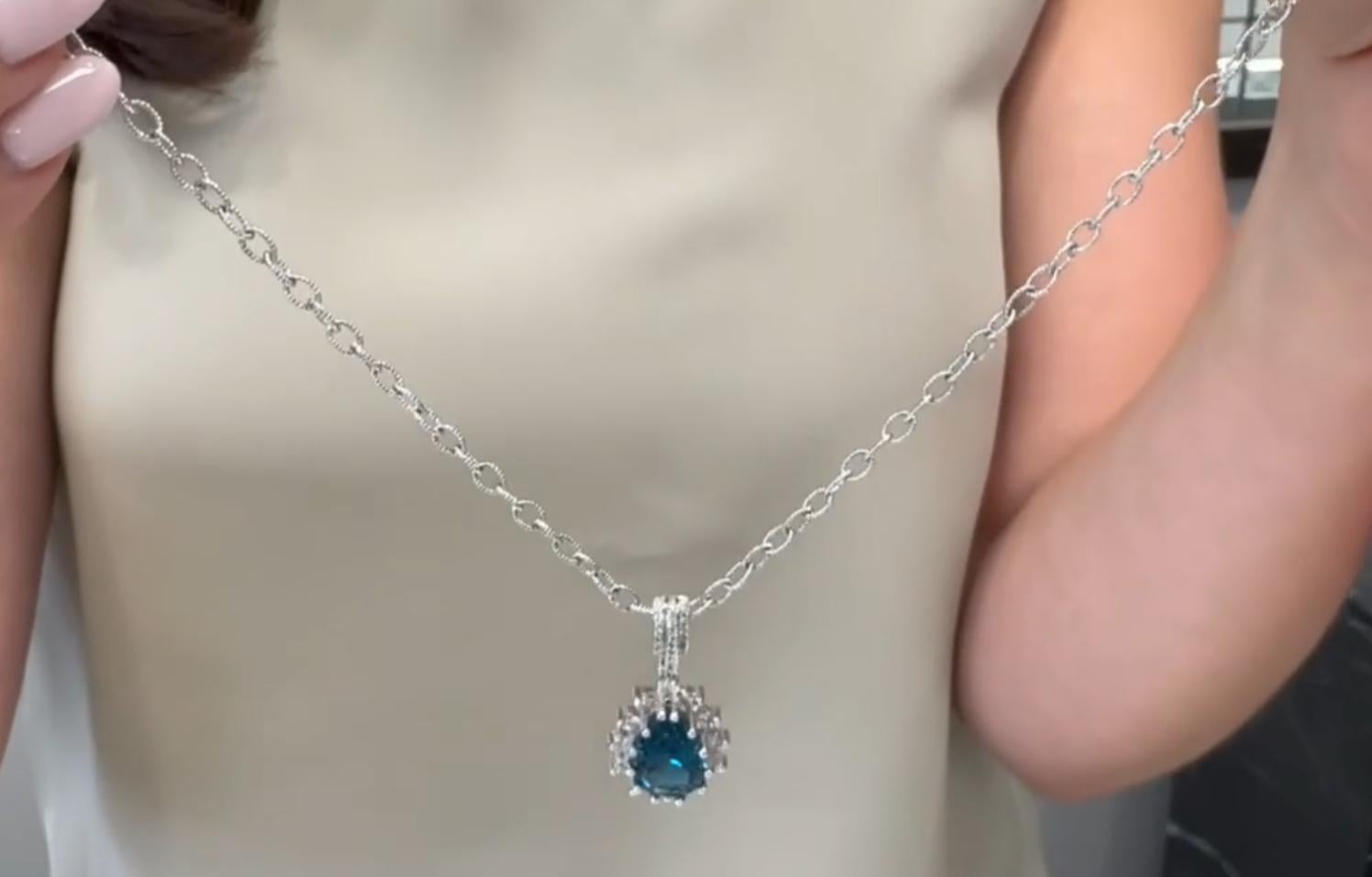 Women's Starburst Pendant Necklace with Pear Shaped London Blue Topaz and Diamonds For Sale
