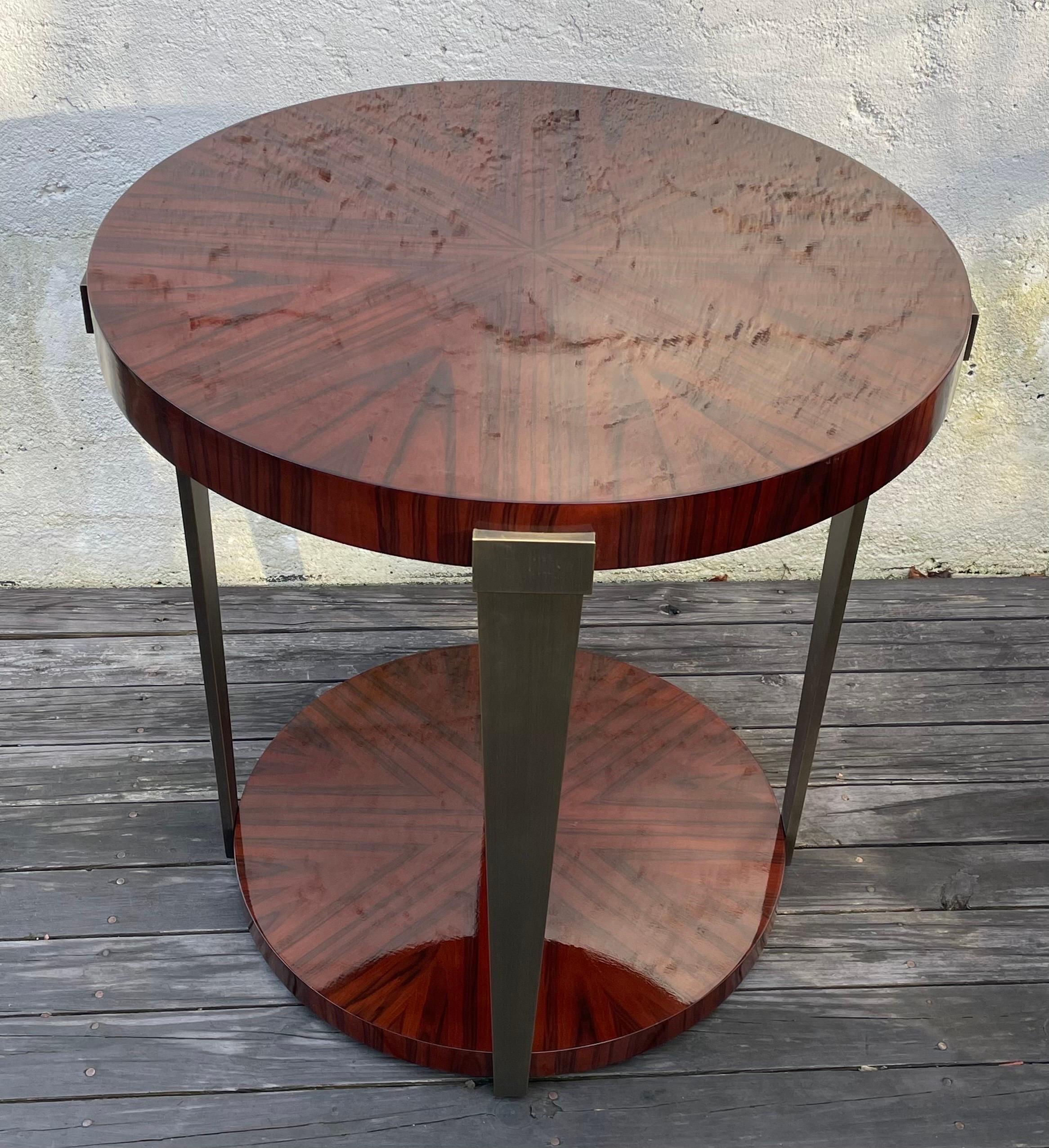 Beautiful Engineered Rosewood round foyer table designed by John Black for Decca home.

John Black is a furniture designer and founder of the creative design firm that bears his name, J Black Design. John Black is the creative visionary behind some